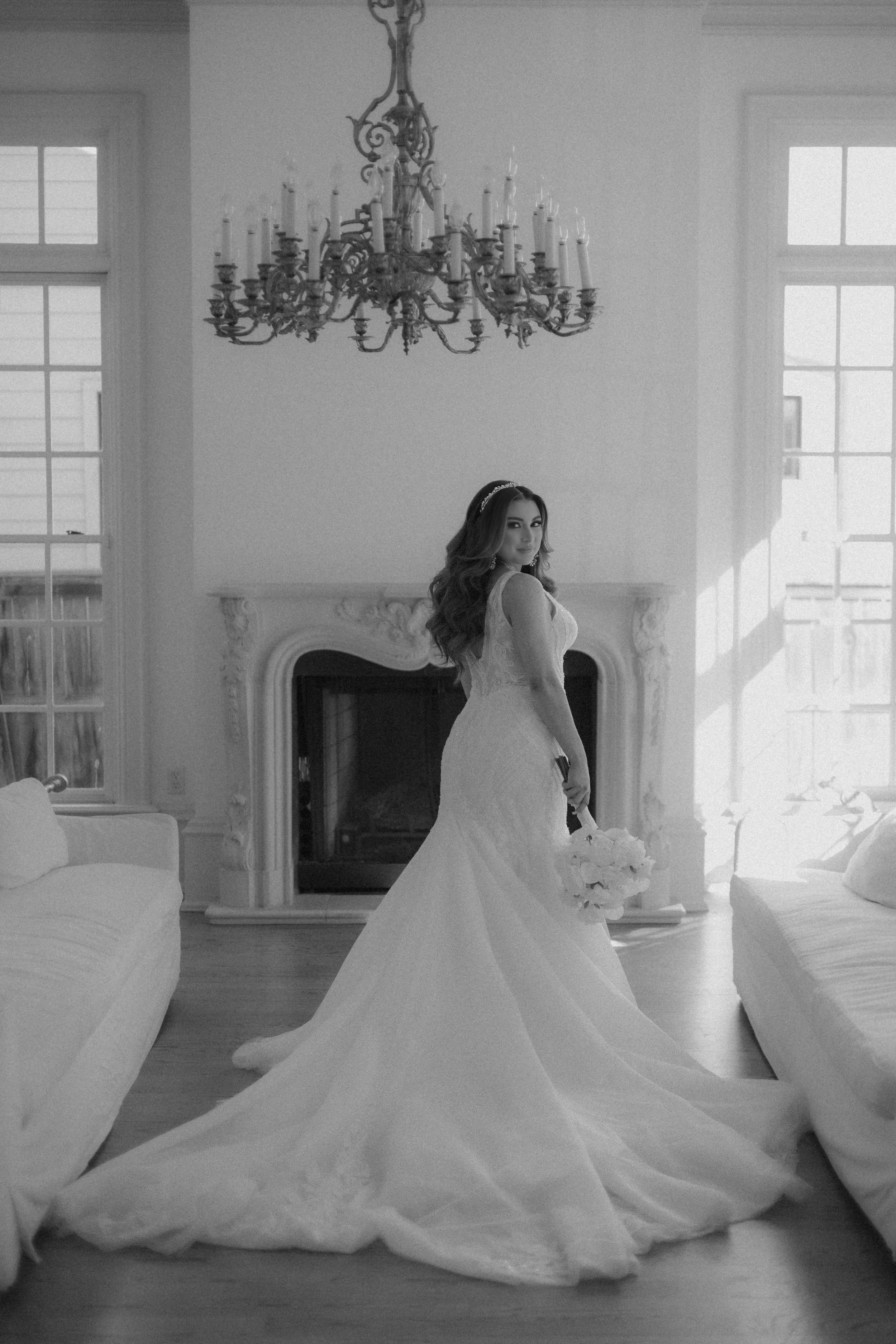 Houston & Texas Family, Couples, Newborn, Maternity, Bridal Photography – Bride standing in sunlight with veil flowing, Houston studio.