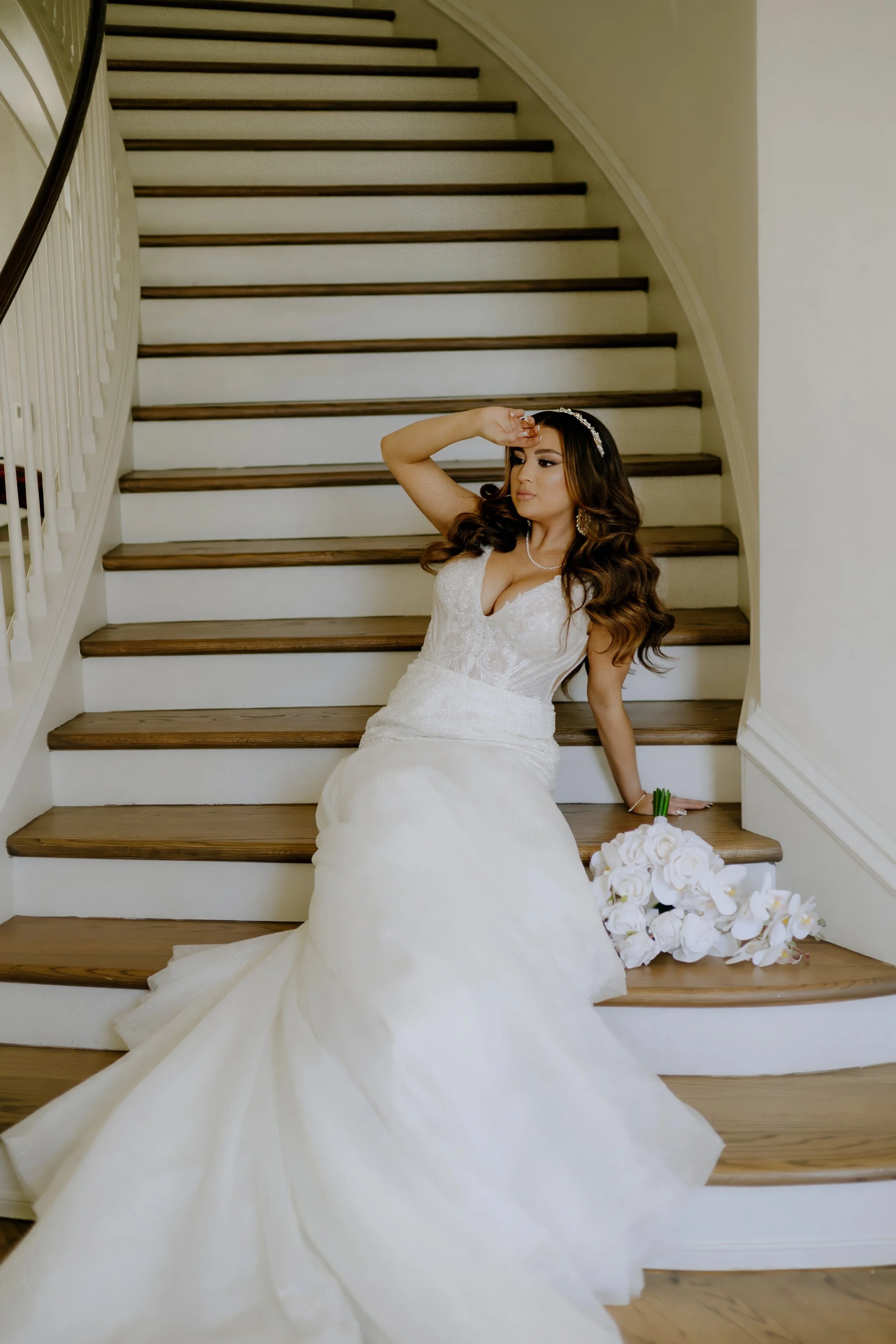 Houston & Texas Family, Couples, Newborn, Maternity, Bridal Photography – Bride posing with gown flowing dramatically down staircase, Houston.