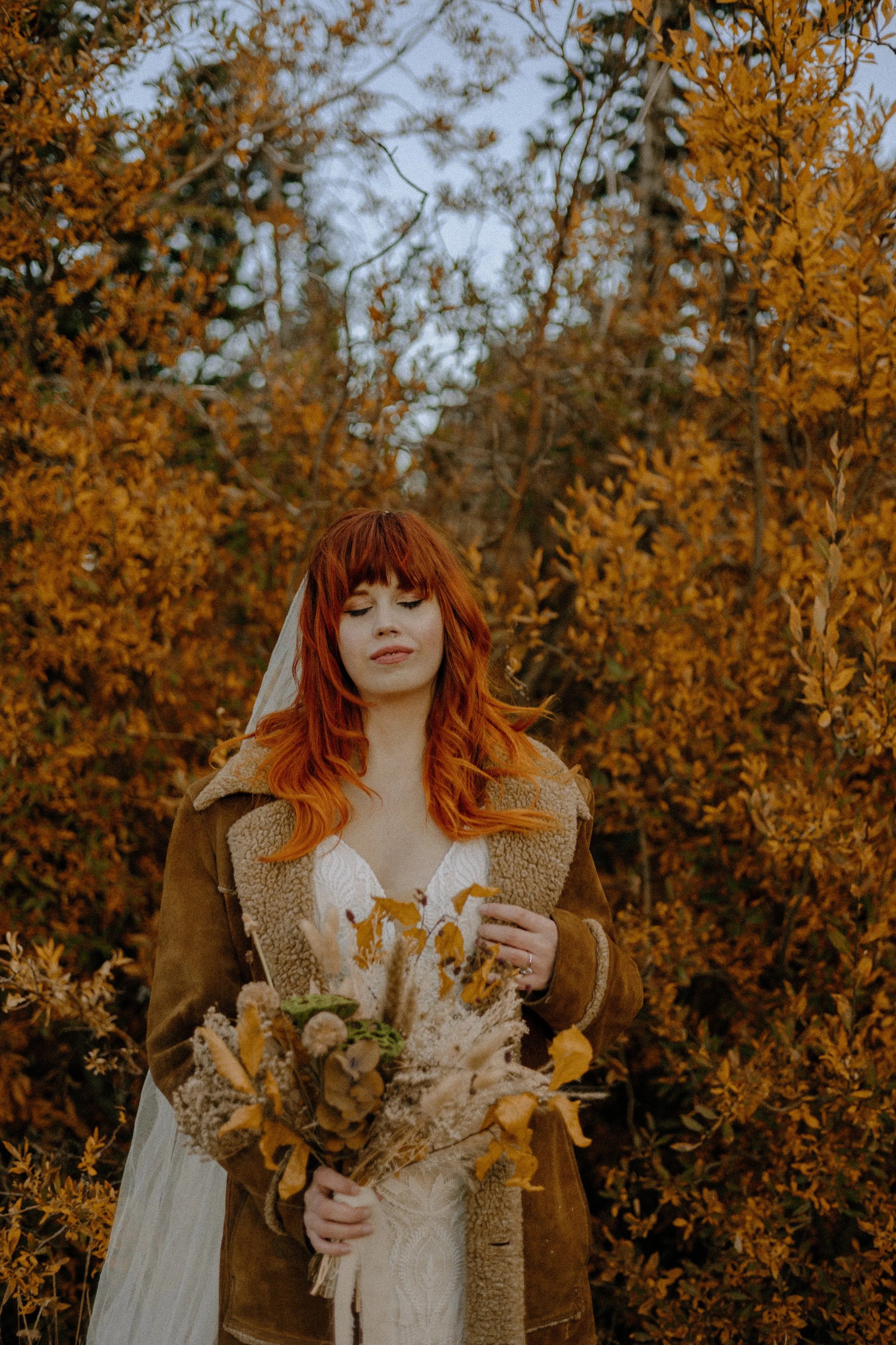 Houston & Texas Wedding & Elopement Photography – Bride in lace gown with fall foliage in Echo Lake Colorado.