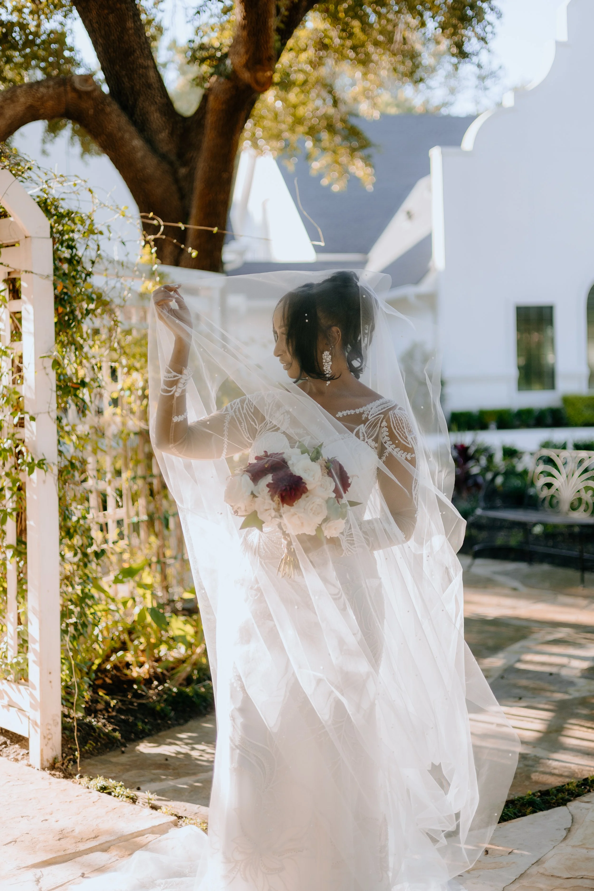Houston & Texas Family, Couples, Newborn, Maternity, Bridal Photography – Bride smiling through veil, Peach Orchard Venue bridal session.