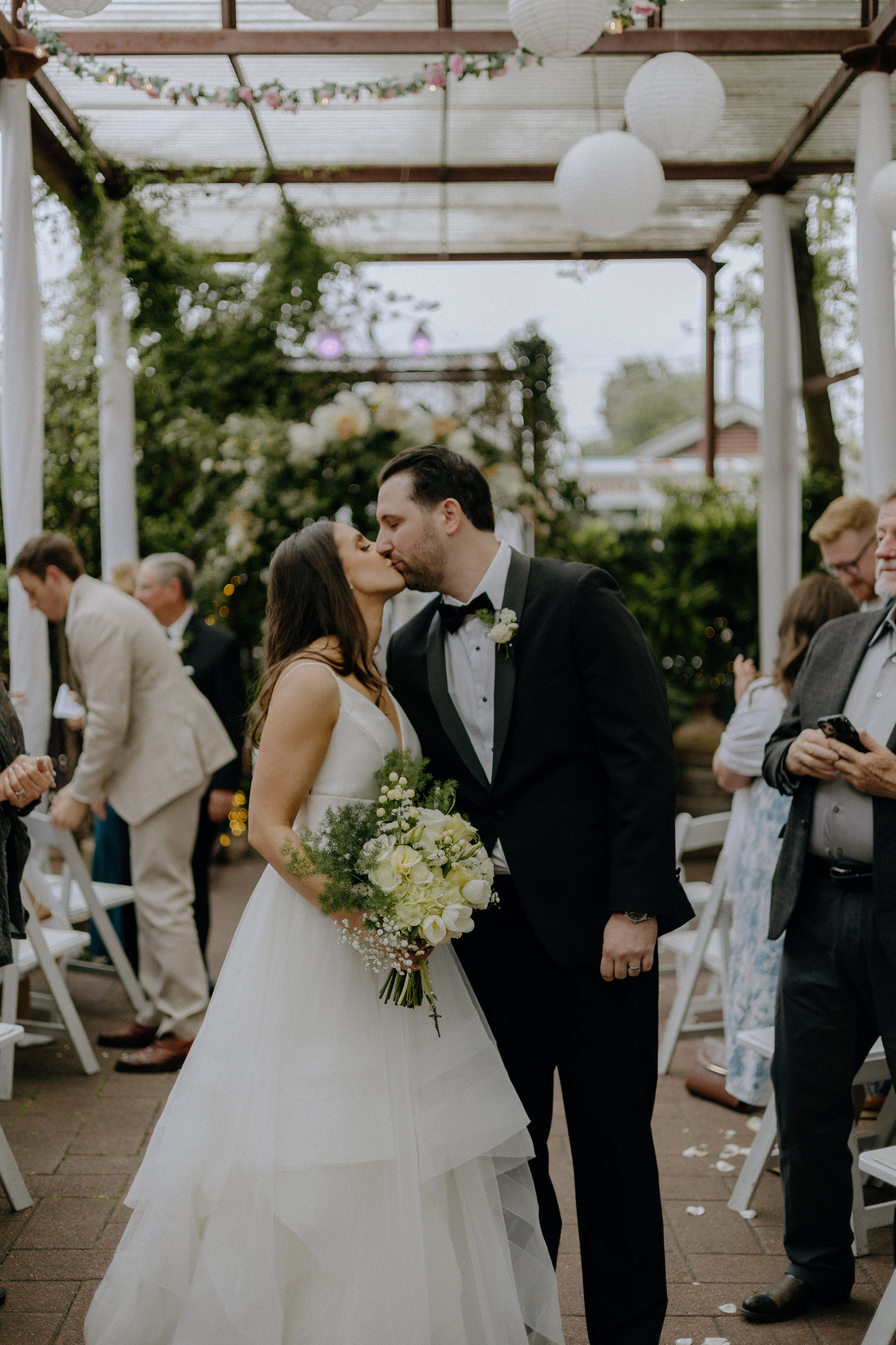 Wedding & Elopement Photography, bride and grooms kissing during reception