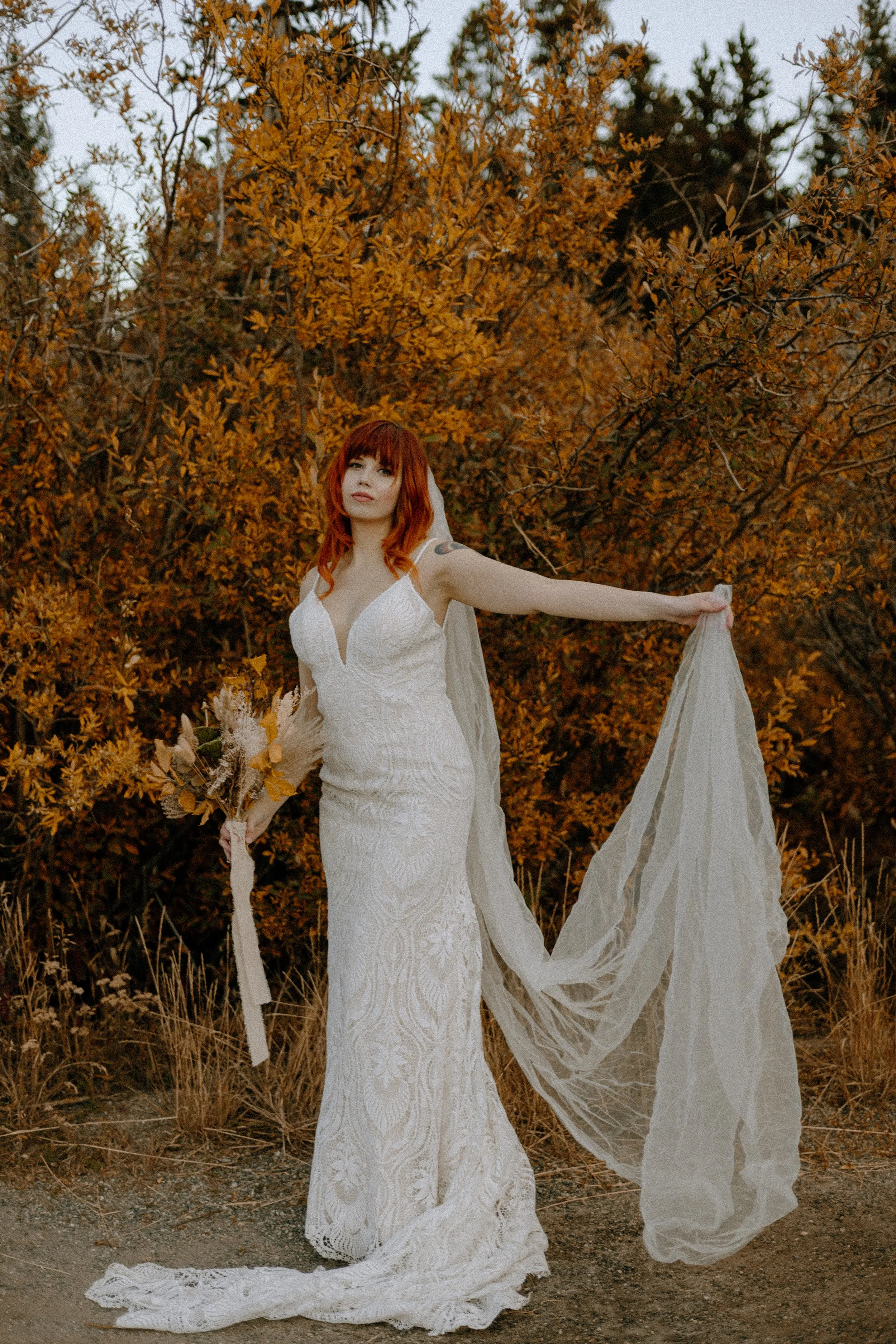 Houston & Texas Wedding & Elopement Photography – Bride walking through autumn trees at Echo Lake Colorado elopement.
