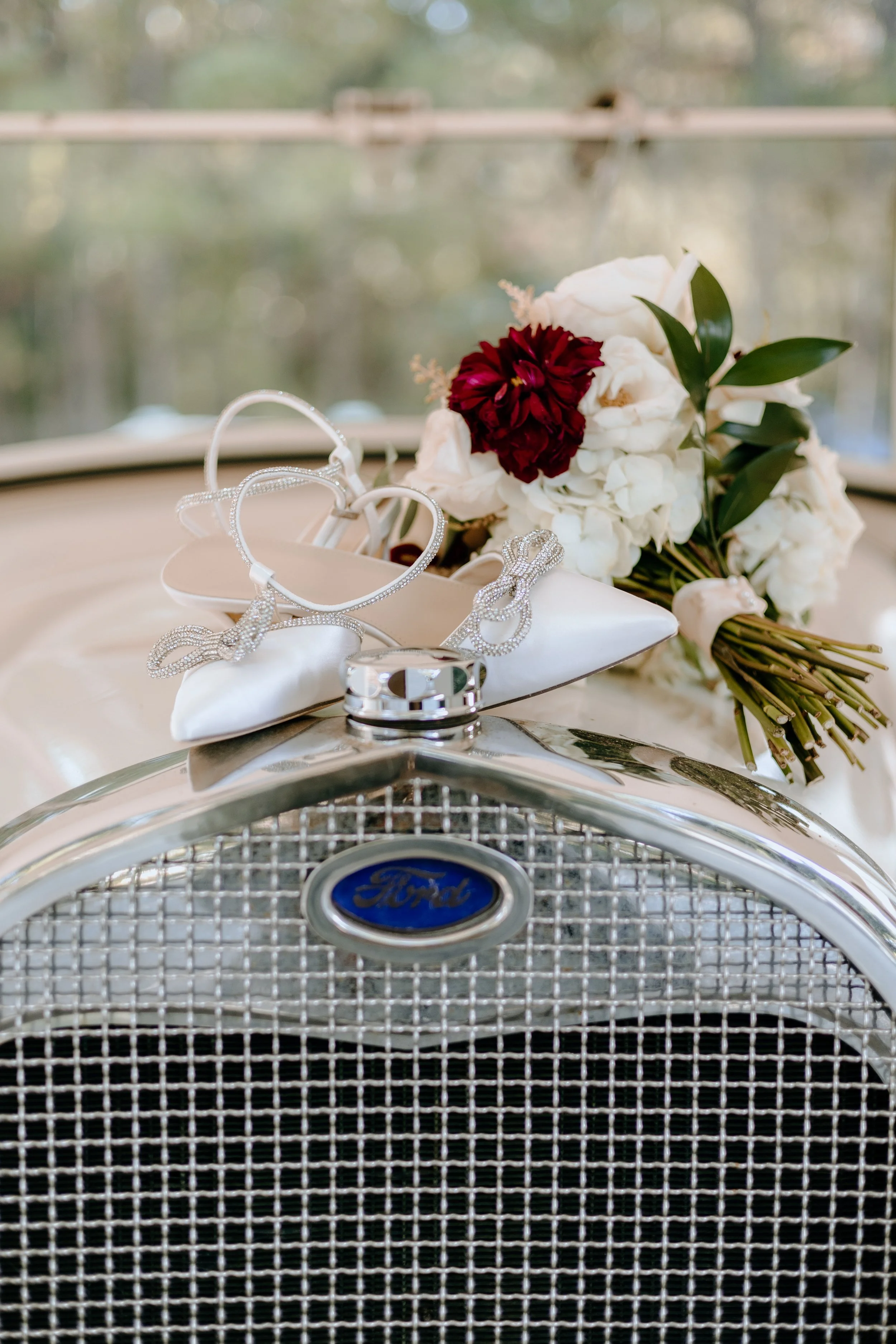 Houston & Texas Family, Couples, Newborn, Maternity, Bridal Photography – Close-up of bouquet resting on vintage car grill, The Woodlands TX.