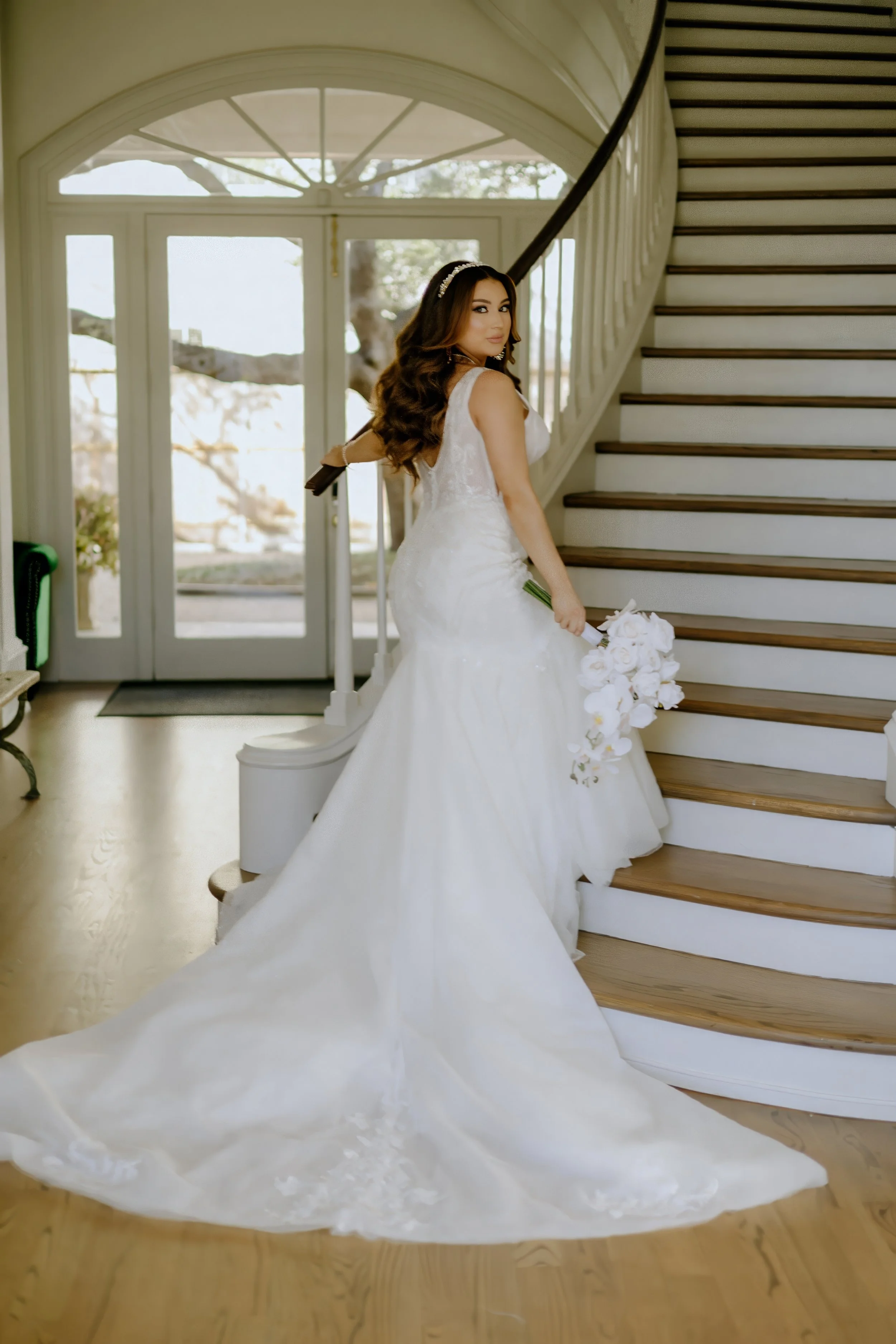 Houston & Texas Family, Couples, Newborn, Maternity, Bridal Photography – Bride holding bouquet while stepping down staircase, Houston.
