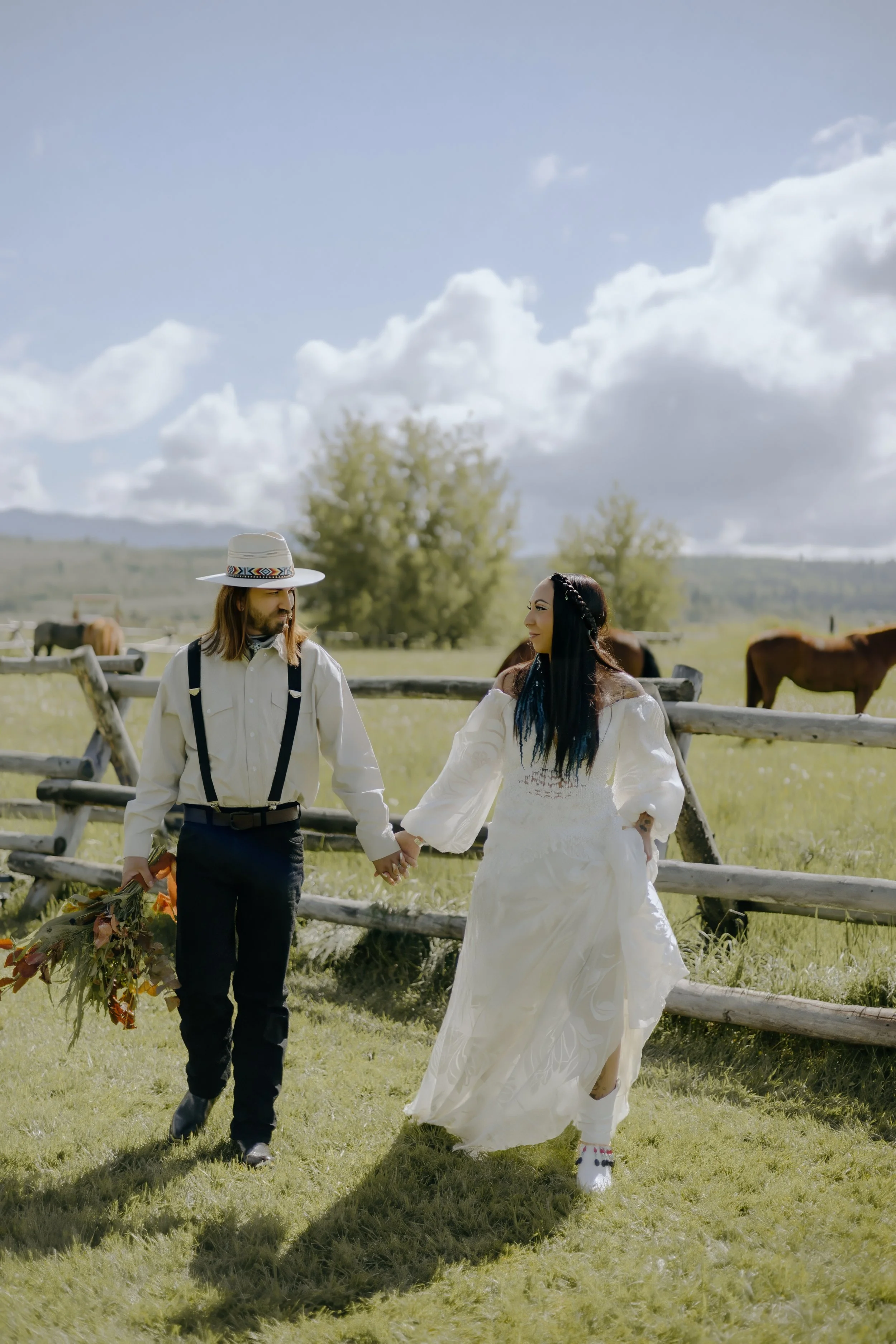 Houston & Texas Wedding & Elopement Photography – Bride in fur shawl embraced by groom in field at Diamond Cross Ranch.