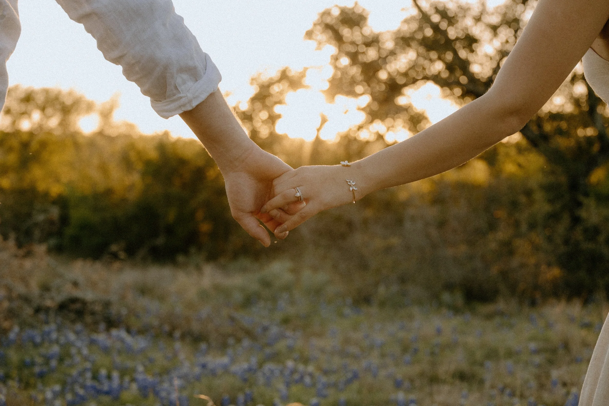 Houston & Texas Family, Couples, Newborn, Maternity, Bridal Photography – Romantic couple holding hands in Austin TX wildflowers.