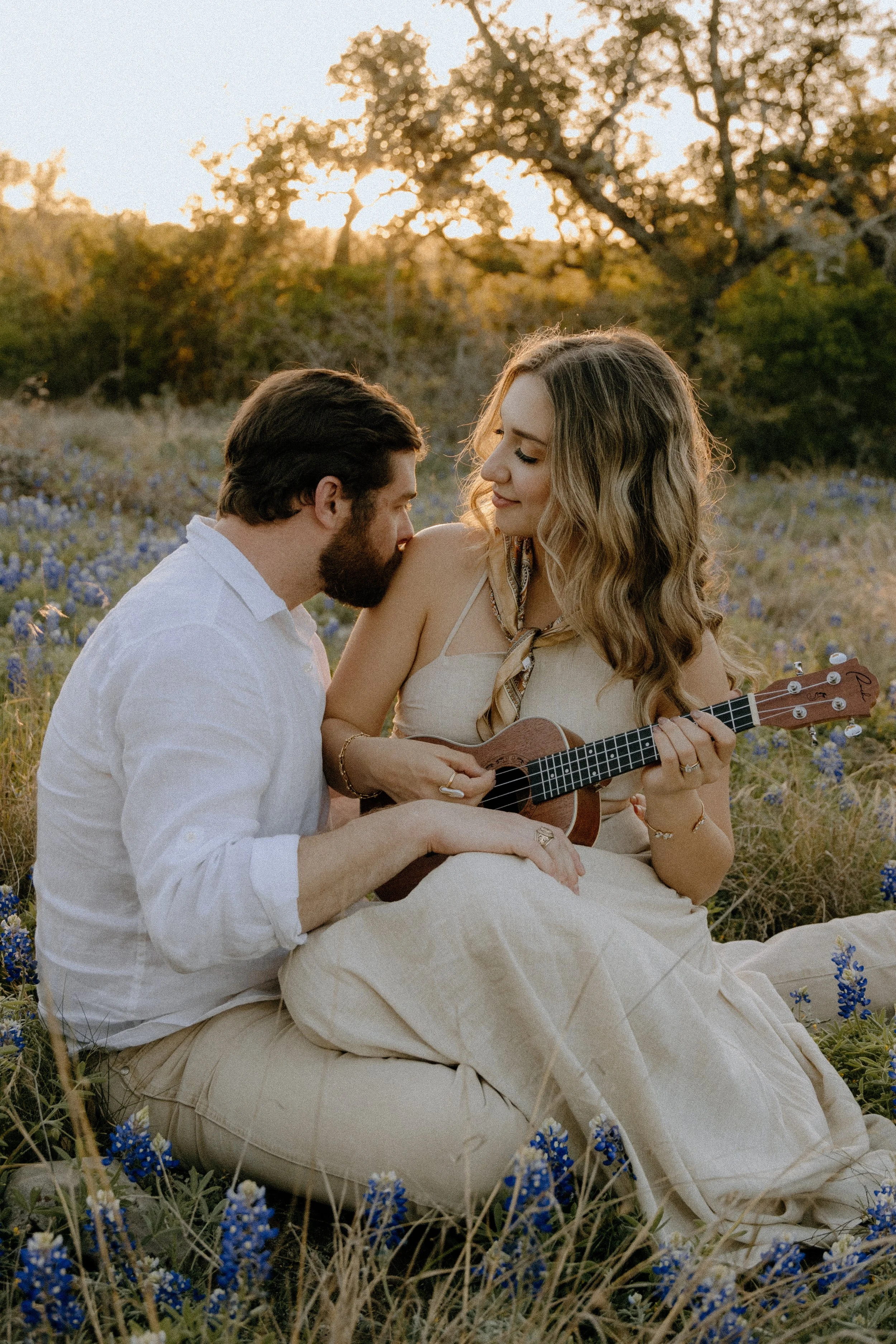 Houston & Texas Family, Couples, Newborn, Maternity, Bridal Photography – Natural candid embrace in Austin TX wildflower field.