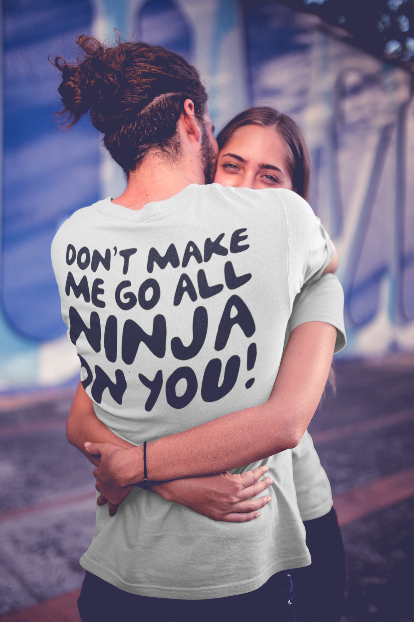 long-haired-man-wearing-a-t-shirt-mockup-hugging-his-girlfriend-a20581.png