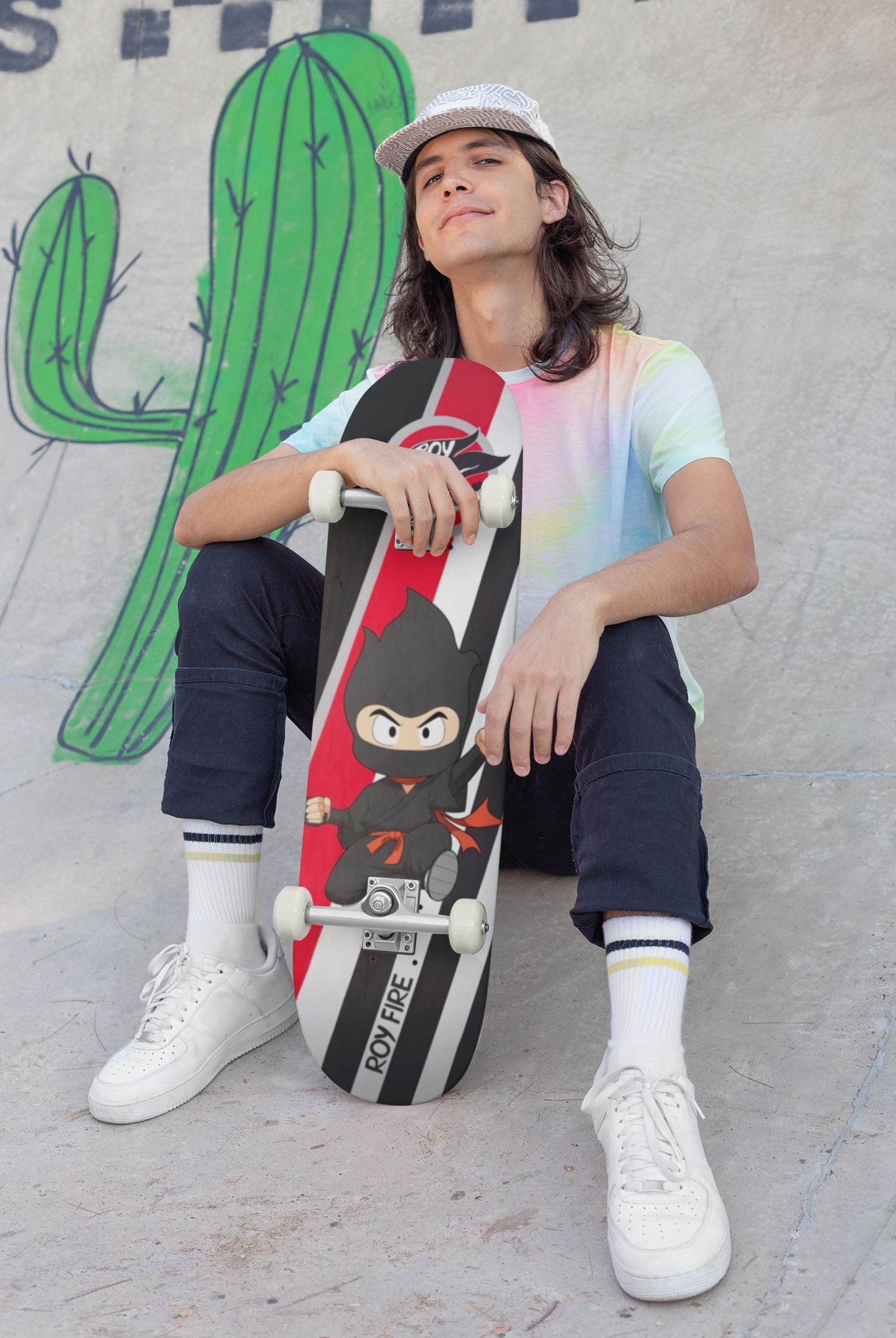 skateboard-mockup-featuring-a-long-haired-man-sitting-on-a-ramp-27191.png