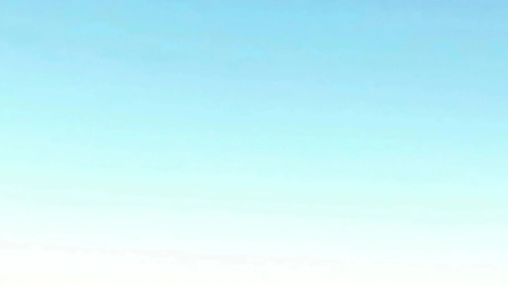 Clear blue sky with a faint, distant horizon line at the bottom of the image.