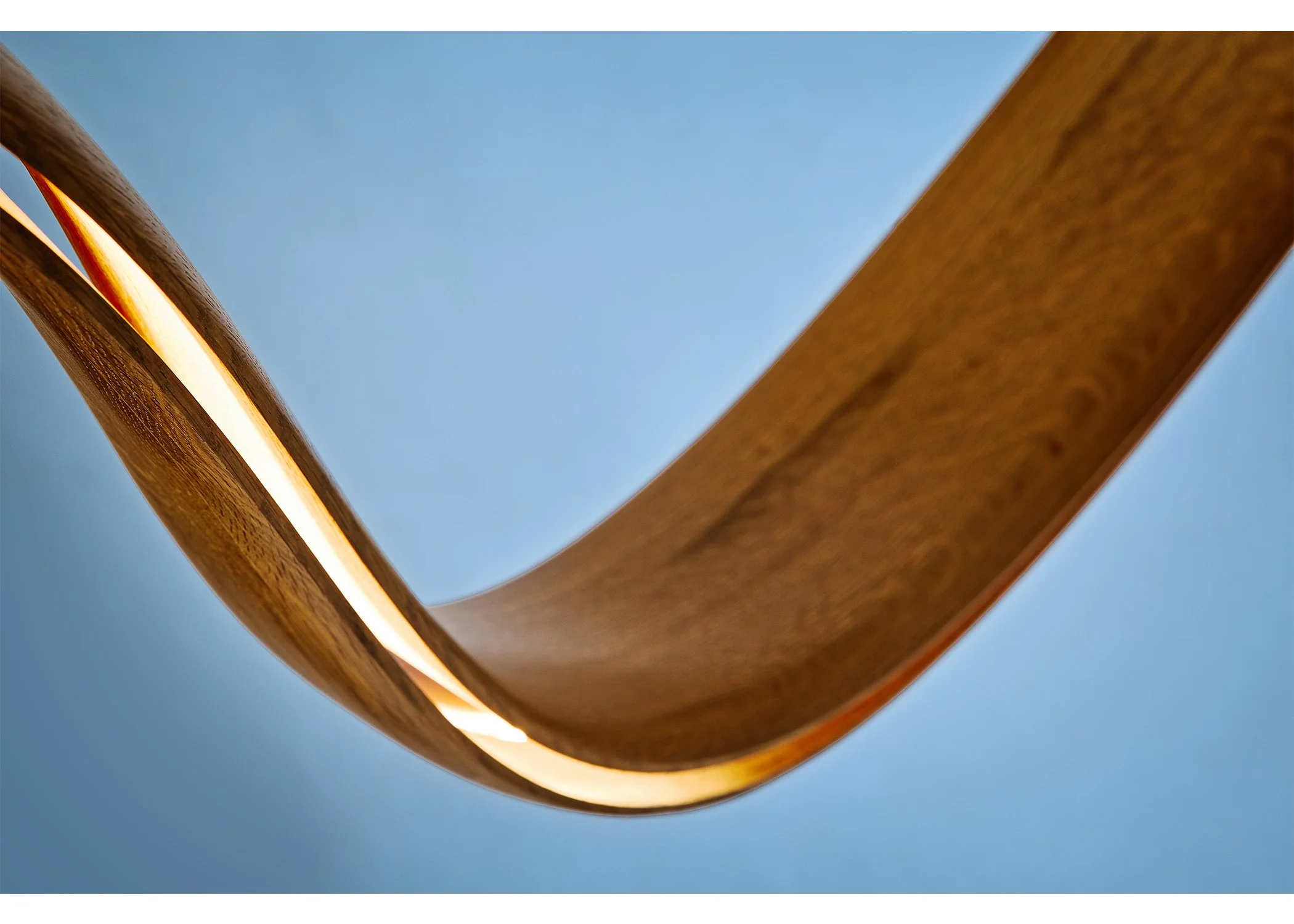 Detail of handcrafted sculptural wood lighting from the INERTIA series by Adam Bentz.
