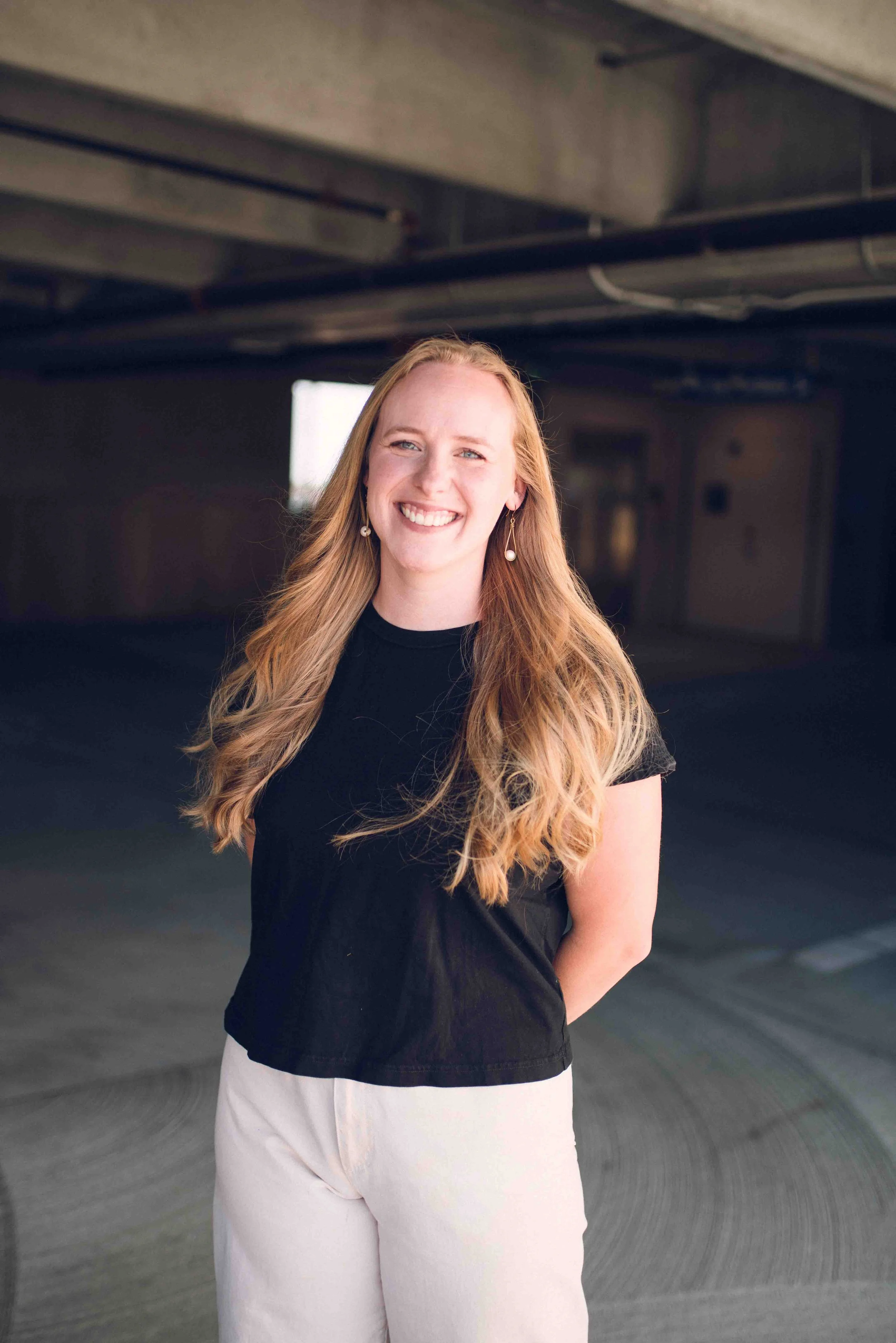 woman receptionist for mental health practice smiling in a warm office environment 