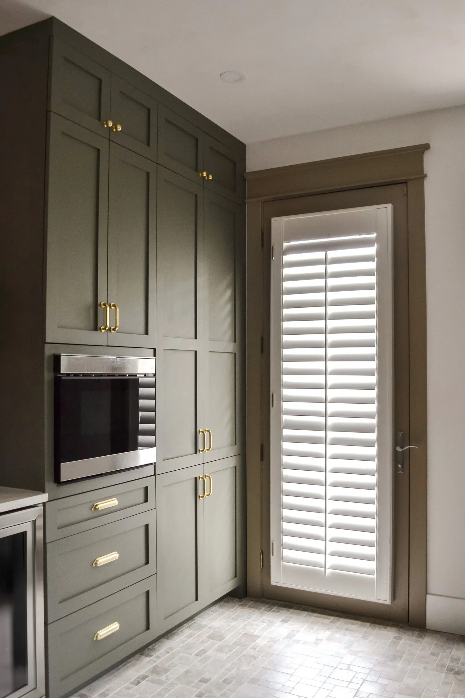 BLUE HERON LAUNDRY CABINETRY.webp