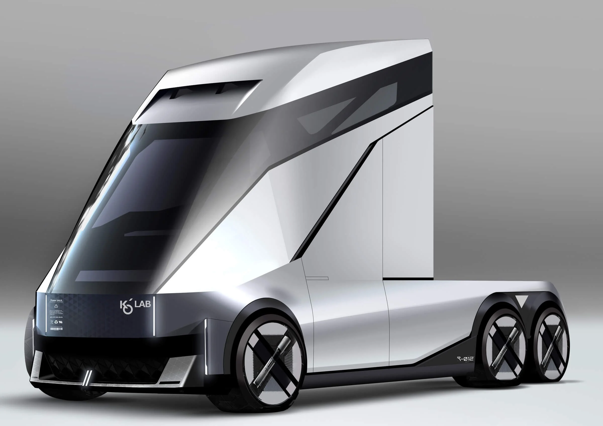 Futuristic autonomous electric truck with sleek silver design and large black wheels.