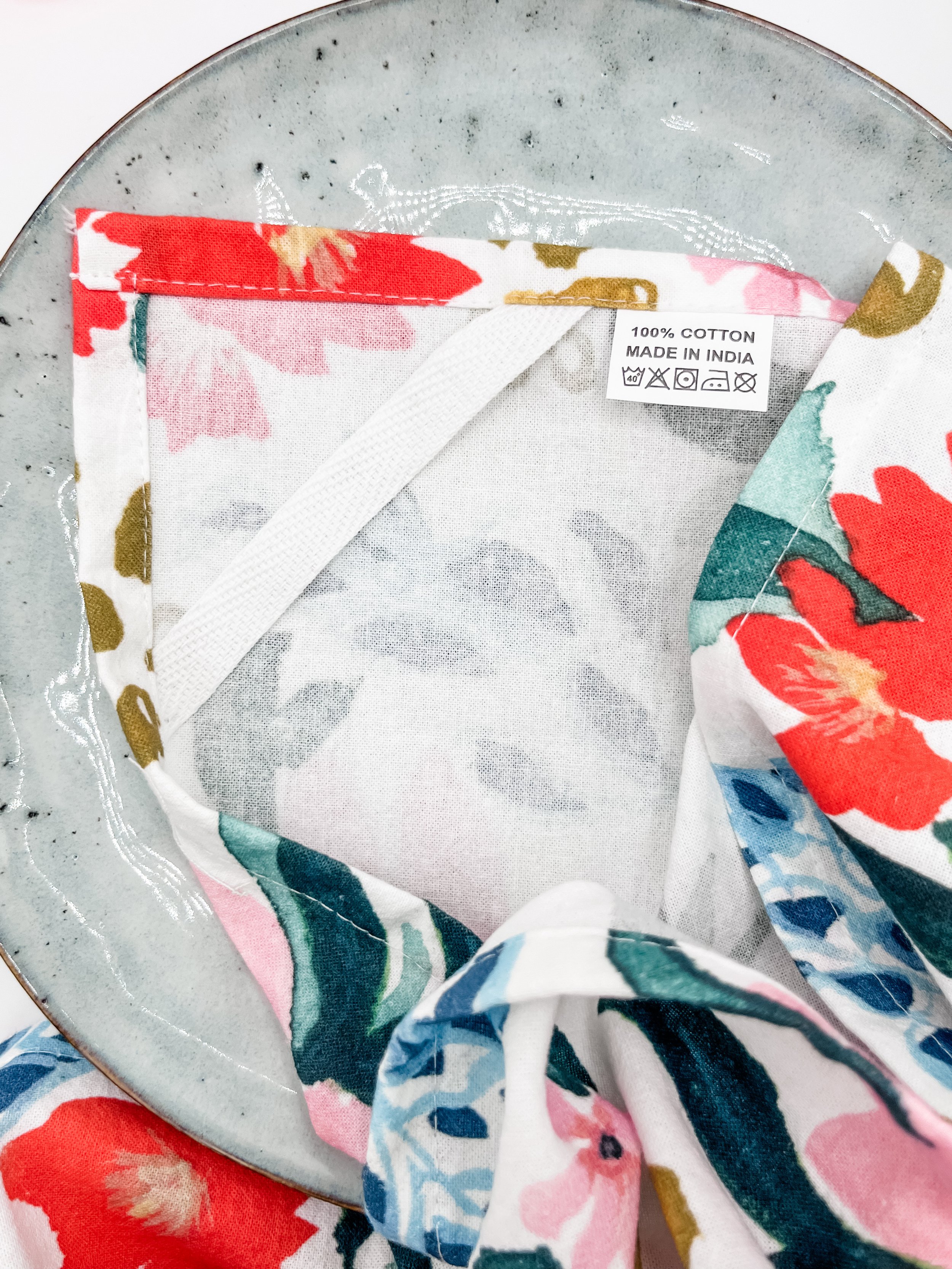 Red and Pink Floral Towel hanging close up.jpeg