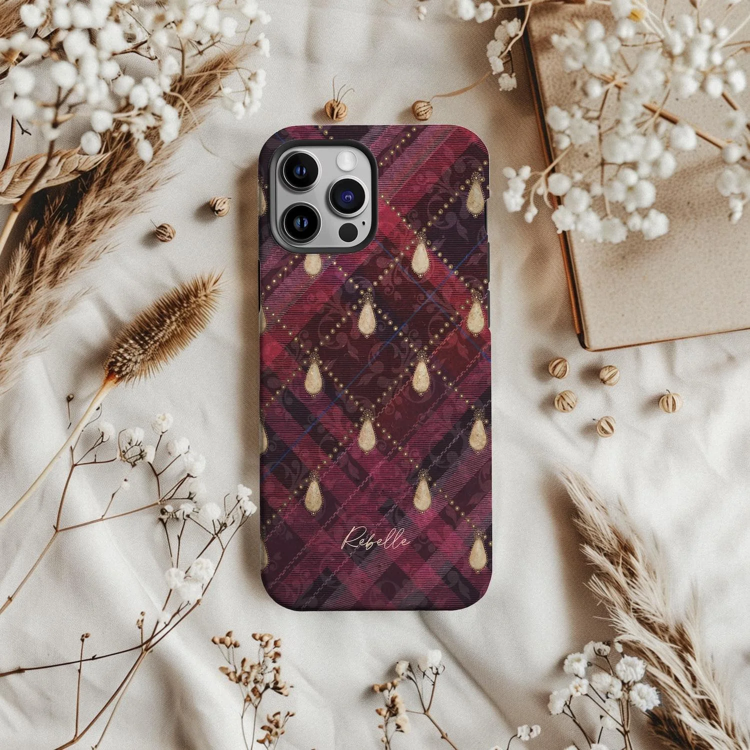 Beautiful art phone case featuring an intricate deep plum tartan design embellished with pearls