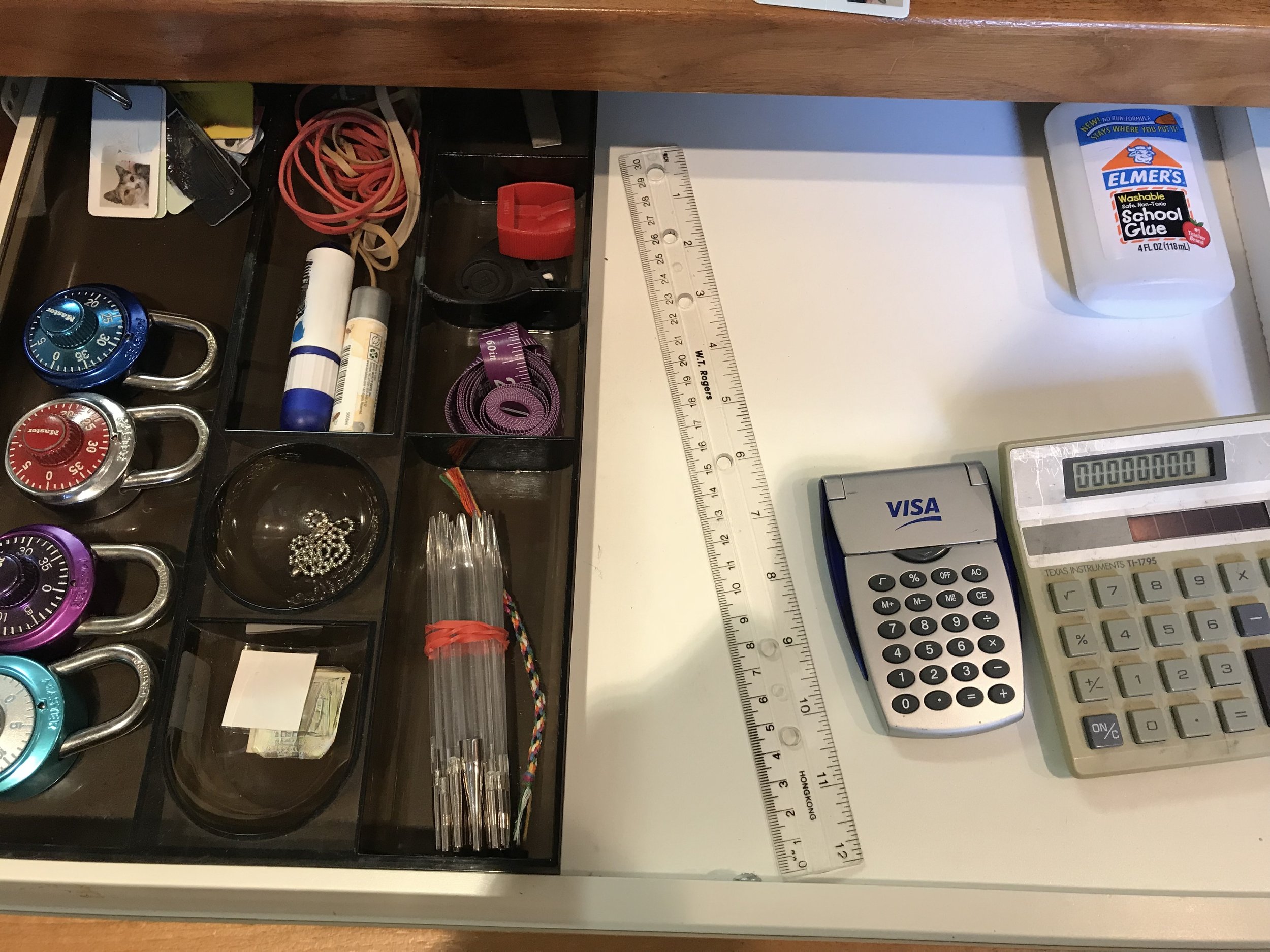 Decluttered and organized office supplies in a drawer.jpeg
