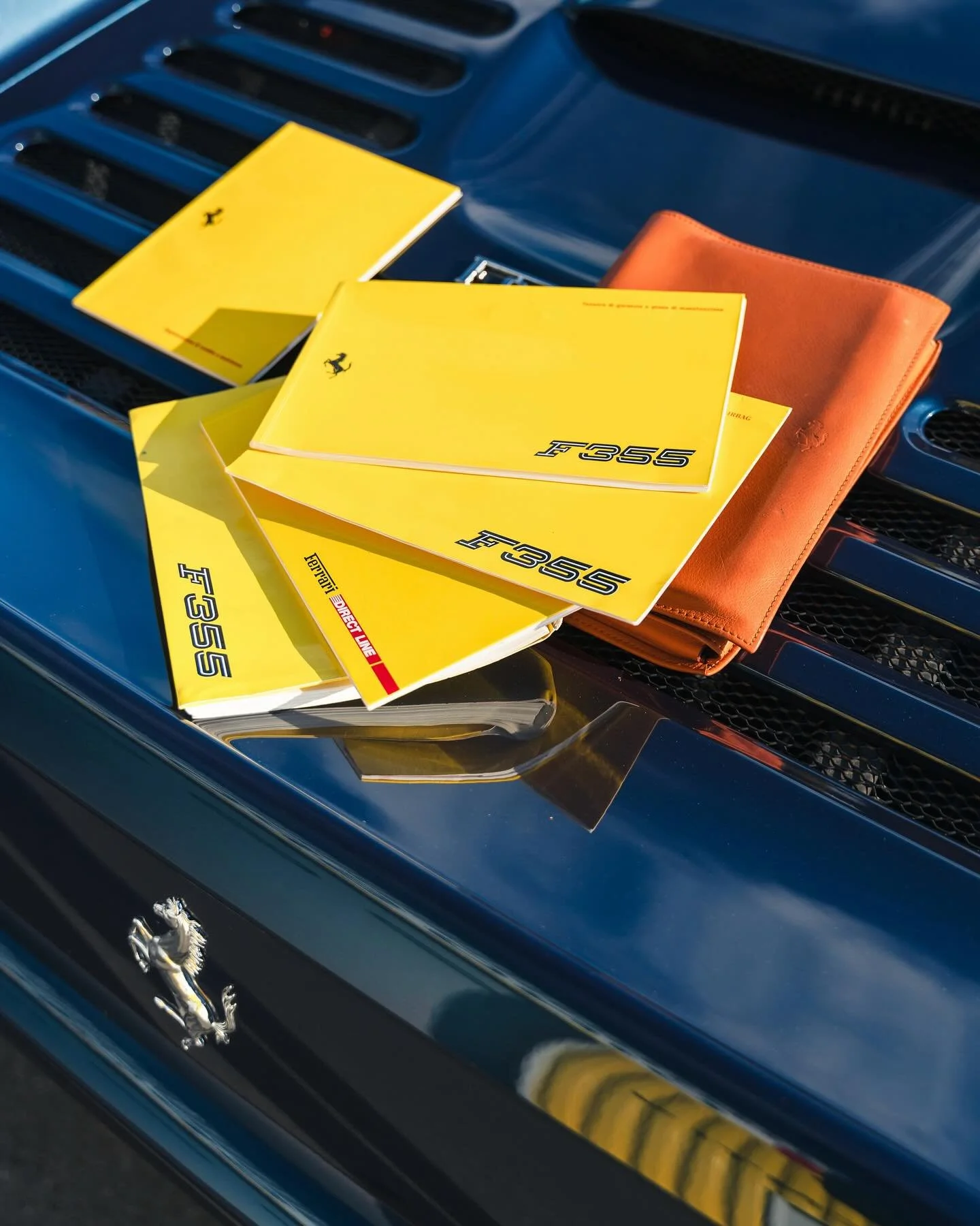 Ferrari F355 GTB 2.7 1995 
Dear gentlemen, what do you think of this wonderful blue swaters on this Ferrari 355 GTB ? 
The contrast of the gray and black leather interior makes the car elegant and at the same time highlights the manual gearbox. 
On s