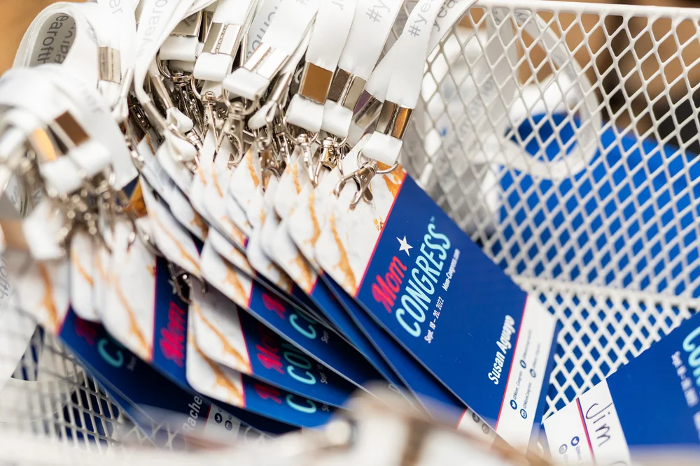Event badges and details arranged for Mom Congress attendees