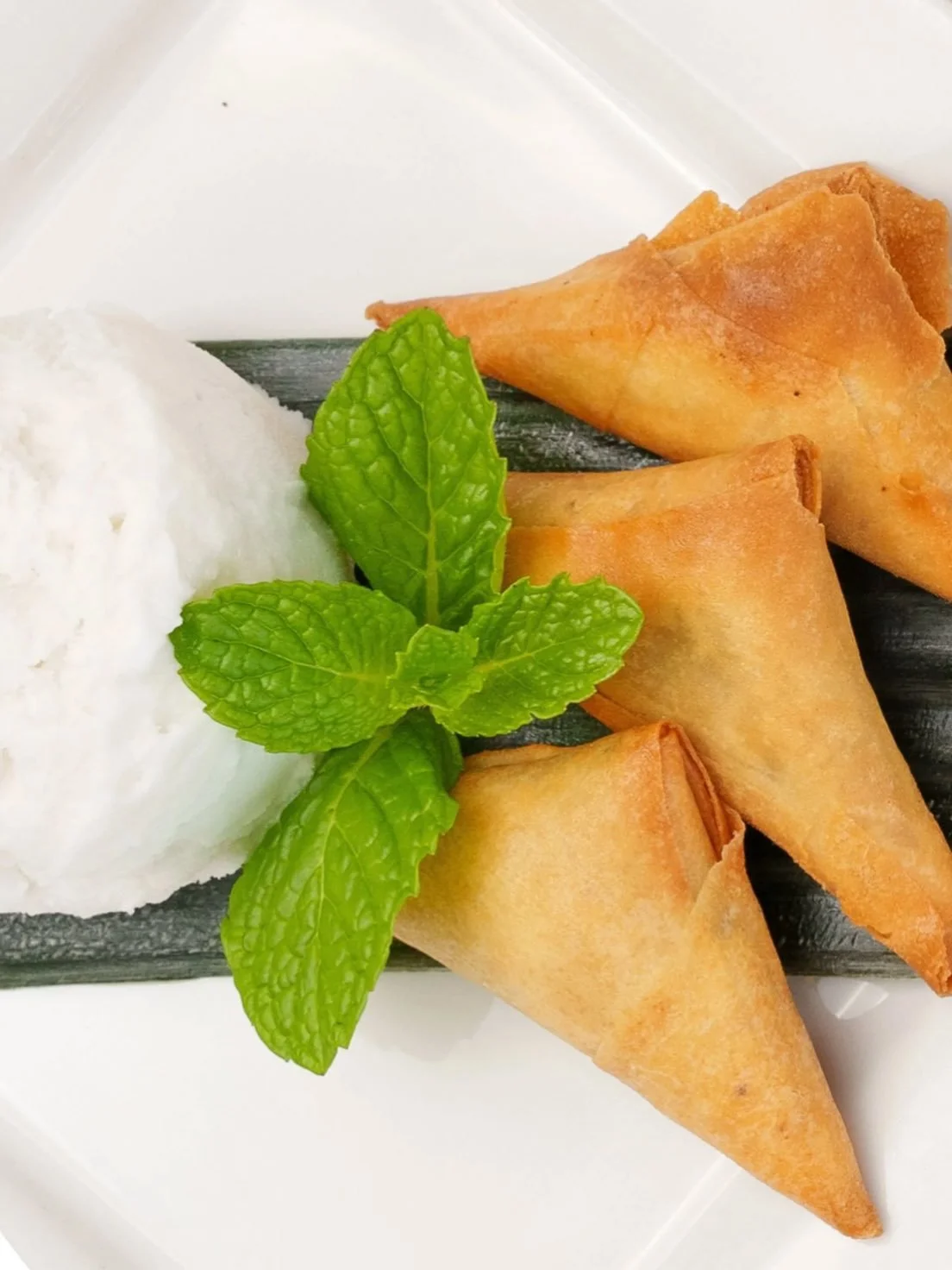Golden, crispy, and filled with pure sweetness. Our Deep Fried Banana Samosa is the perfect little indulgence&mdash;flaky pastry wrapped around ripe, naturally sweet bananas with a subtle hint of spice, all fried to perfection. One bite and you get t