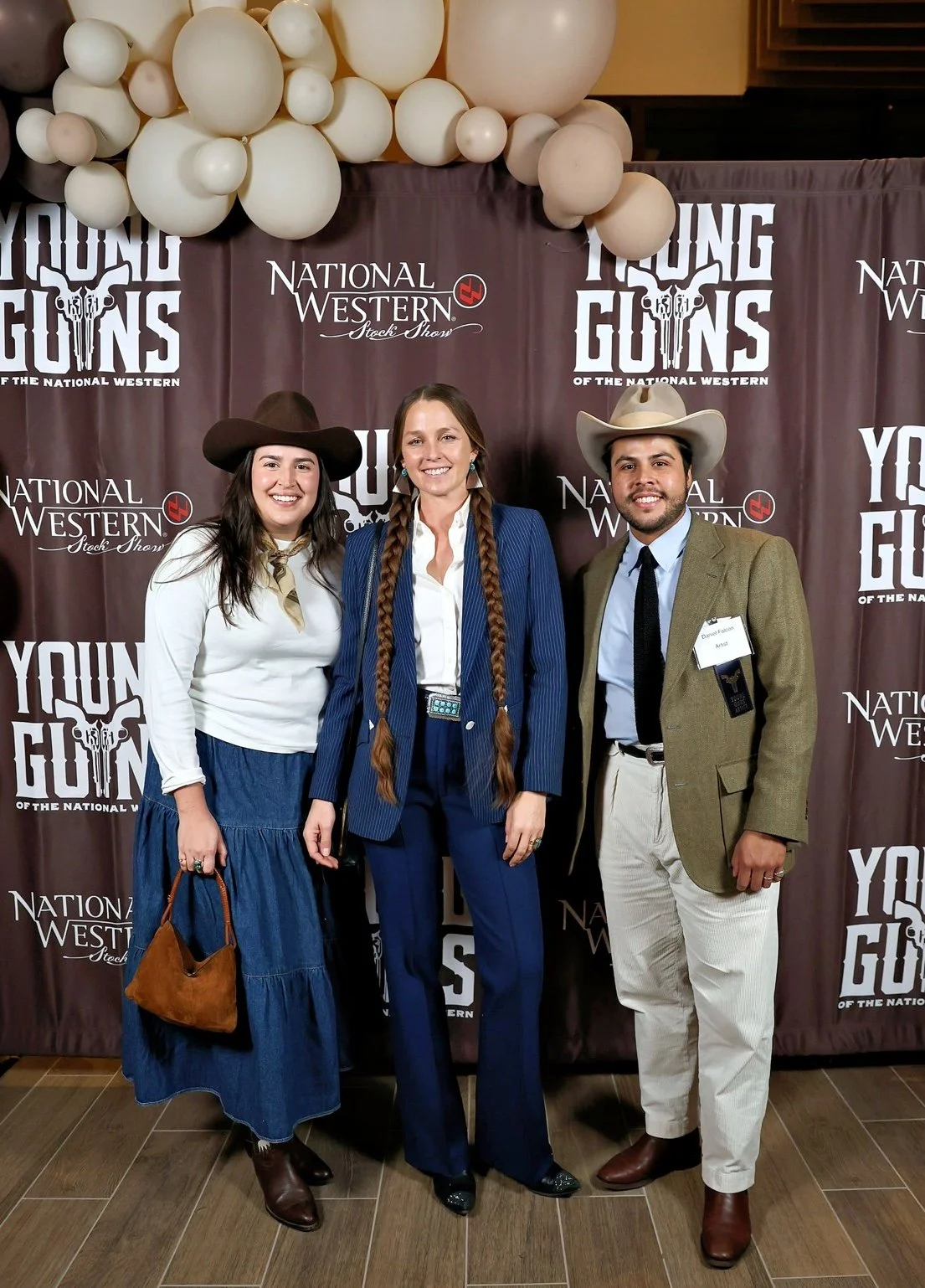 Artist Gina Teichert with Andrea and Daniel Falcón in Denvere, Colorado, for the Young Guns red carpet event