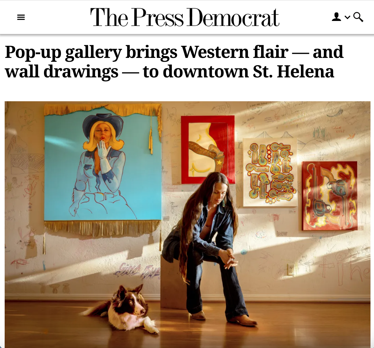 artist gina teichert in front of her paintings at the wine/country exhibition in Saint Helena