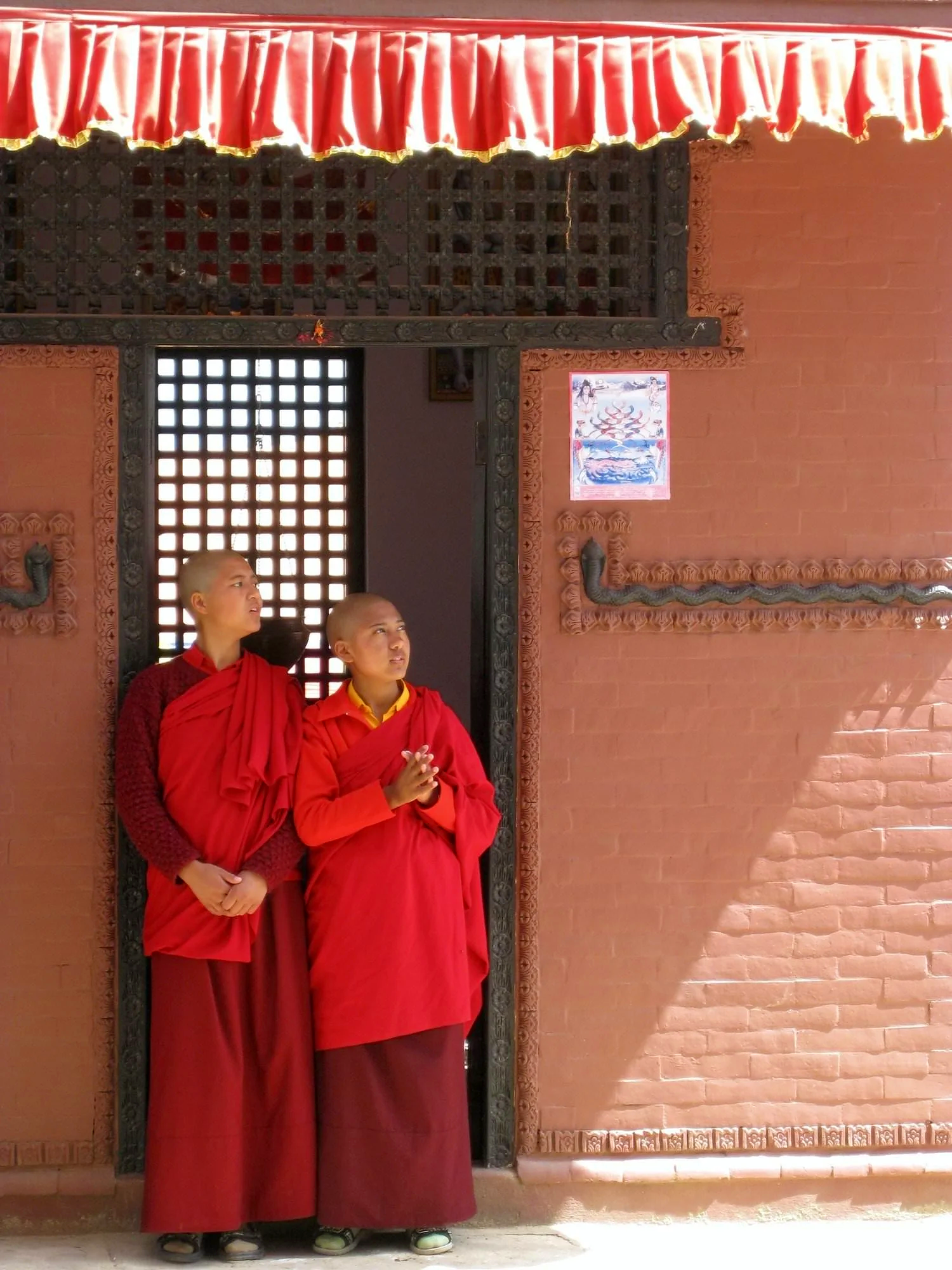 Nuns outside shrine to Shiva steps away from  Kudung temple, Pharping, Nepal (2008)