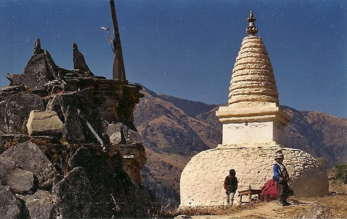Clear blue sky on a winter's day in the foothills of Mount Everest; latse and stone stupa along trekkers' path to Thubten Choling Monastery, Solukhumbu,  Nepal (1996)