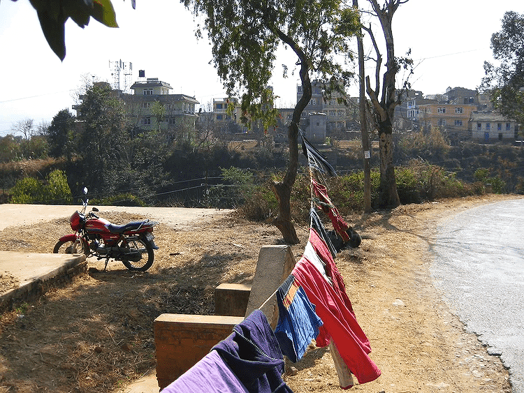Motorbike and laundry in the sun, Pharping roadside, Nepal 