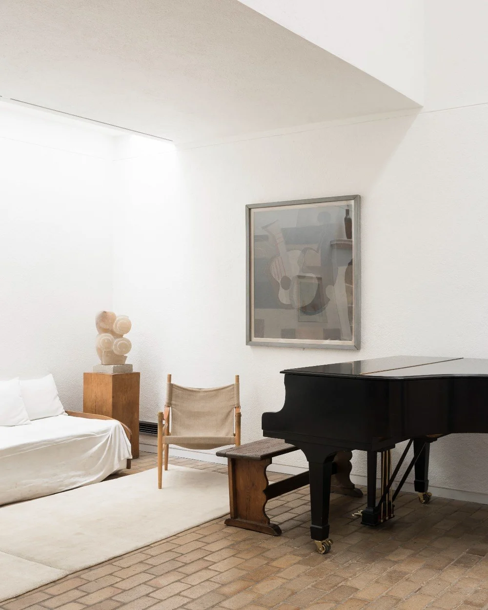 interior shot of piano sofa and artwork in kettles yard by ed park