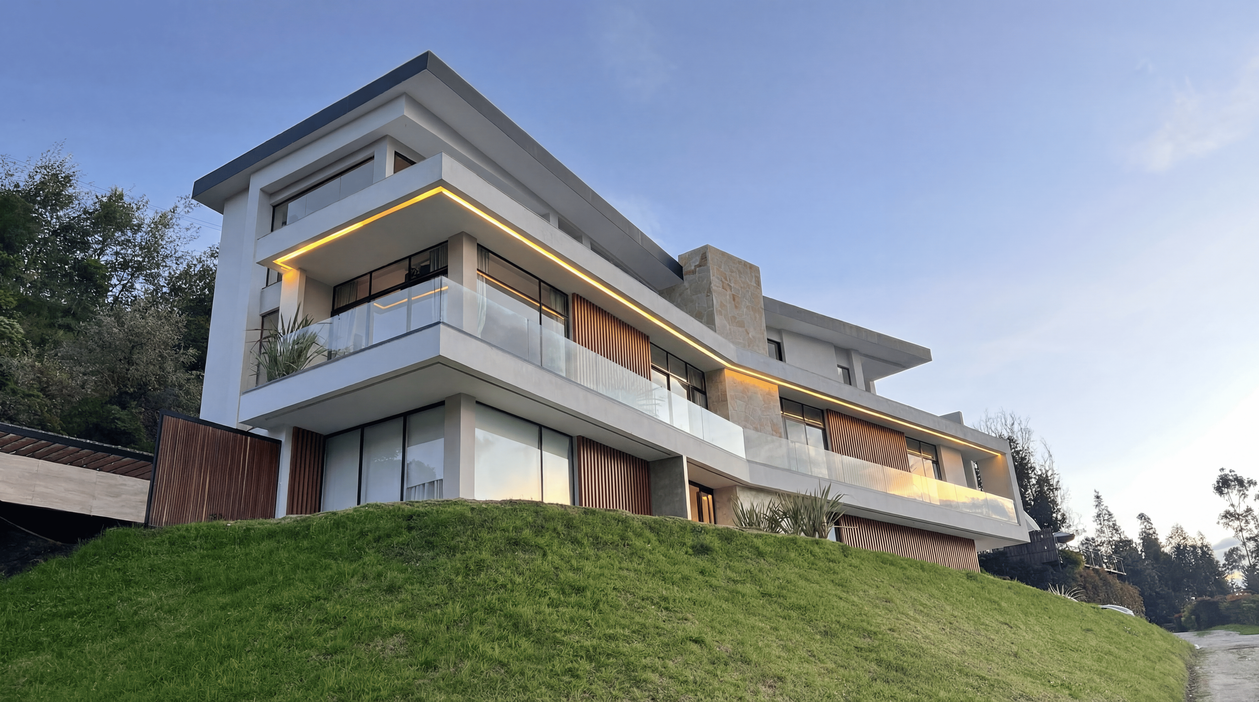 On_this_real_photo_of_a_modern_house__add_vertical_wooden_slats_ONLY_on_the_areas_marked_in_red__Rep (1).png