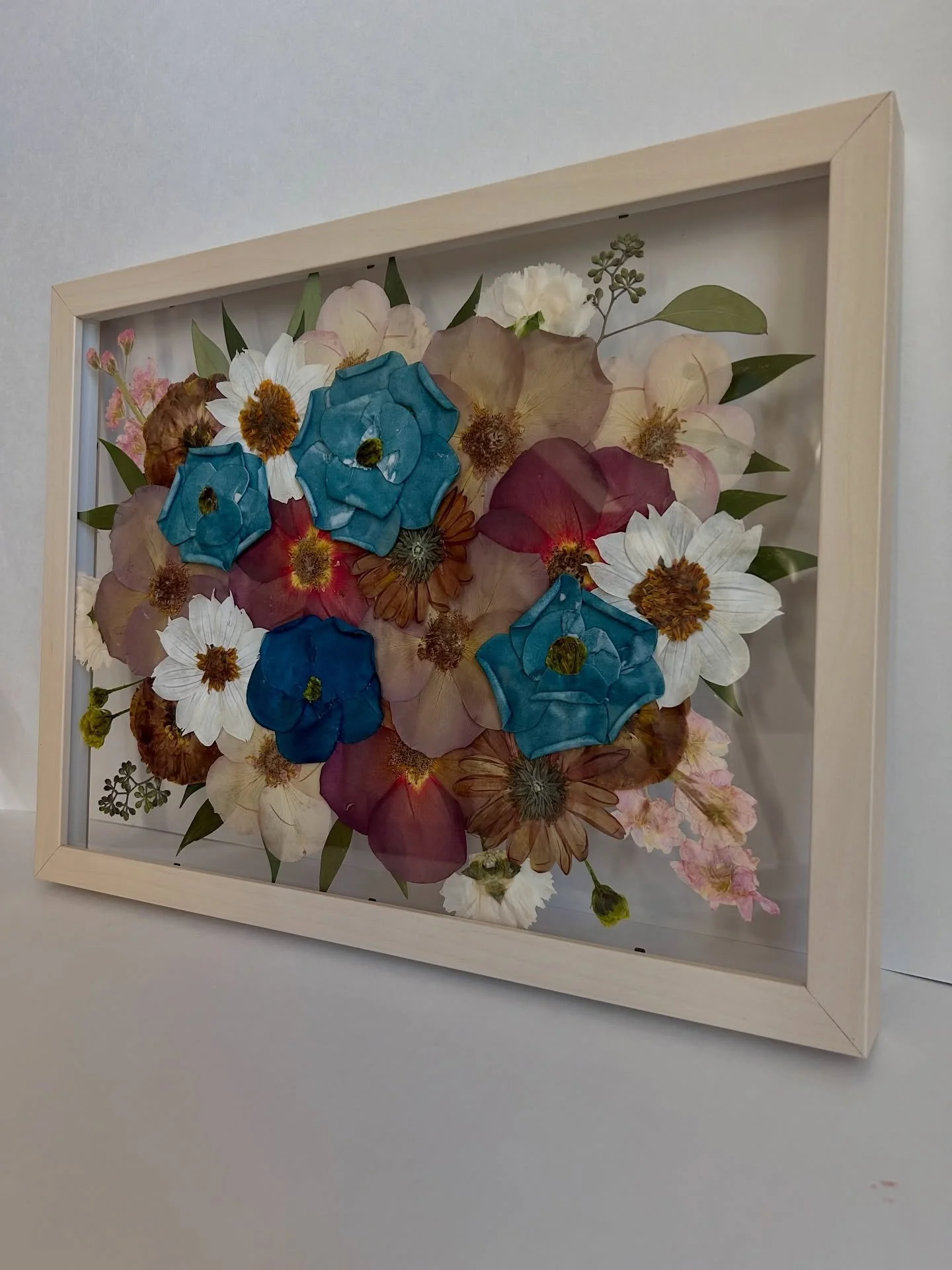 Swipe for the before! ➡️

I&rsquo;m still swooning over Lexie&rsquo;s bouquet 🥹🍂💙

Full of rich fall tones with the most beautiful pops of blue &mdash; such a stunning combination and even more meaningful knowing these flowers now get to live on f