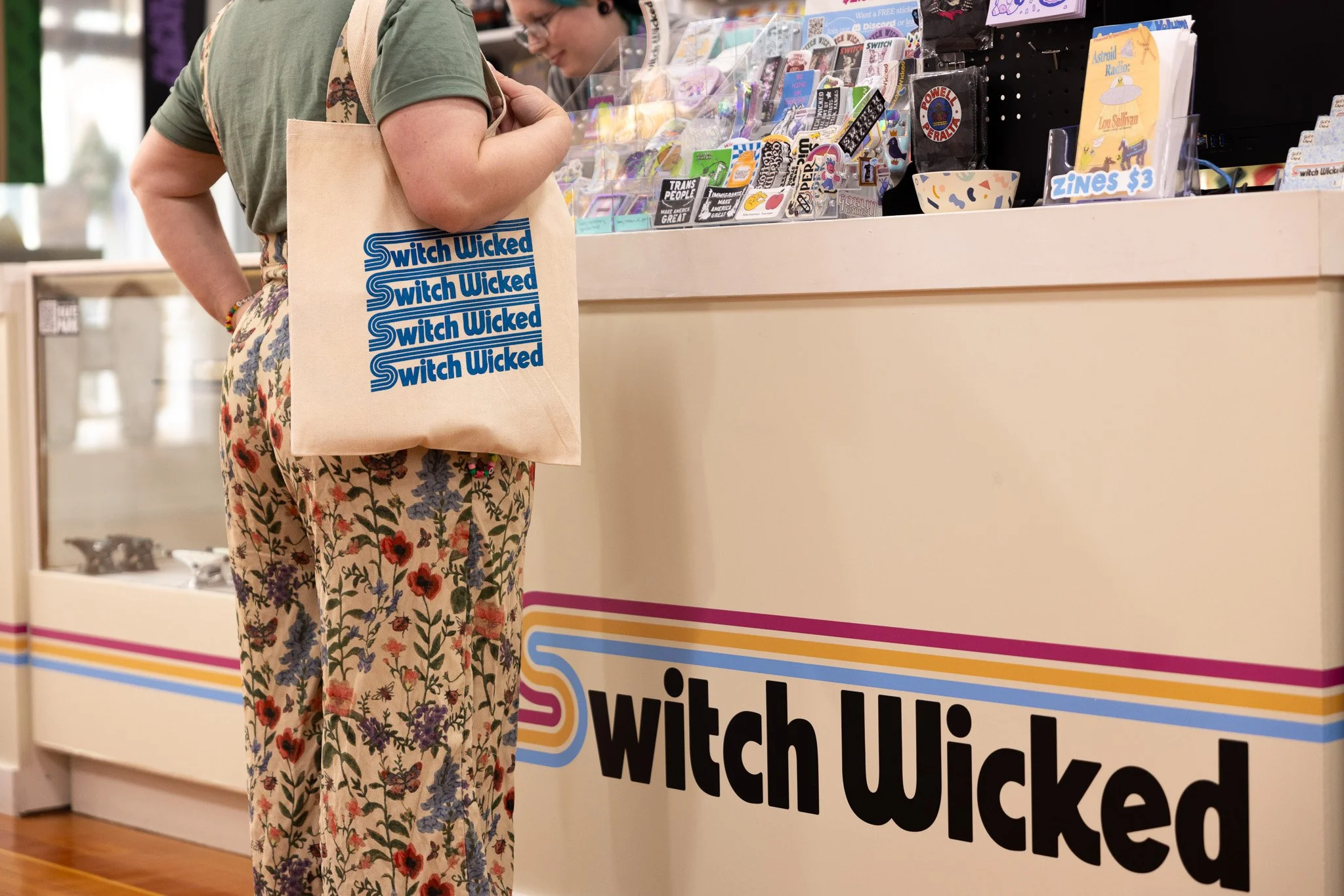 Custom indoor signage designed and printed for the front counter at Switch Wicked, creating a bold branded focal point