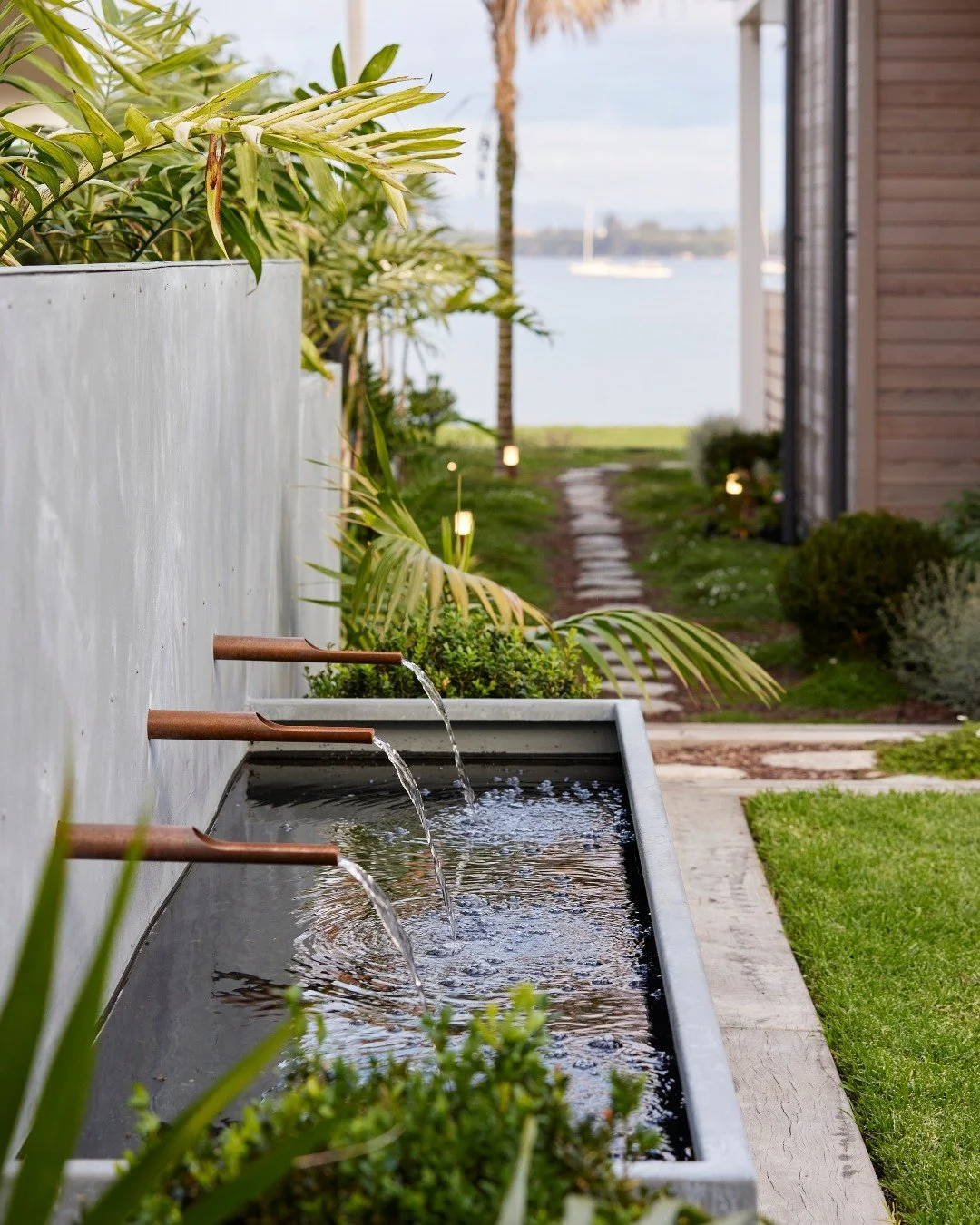 Subtle and considered: the courtyard water feature adds movement and texture to the outdoor space.