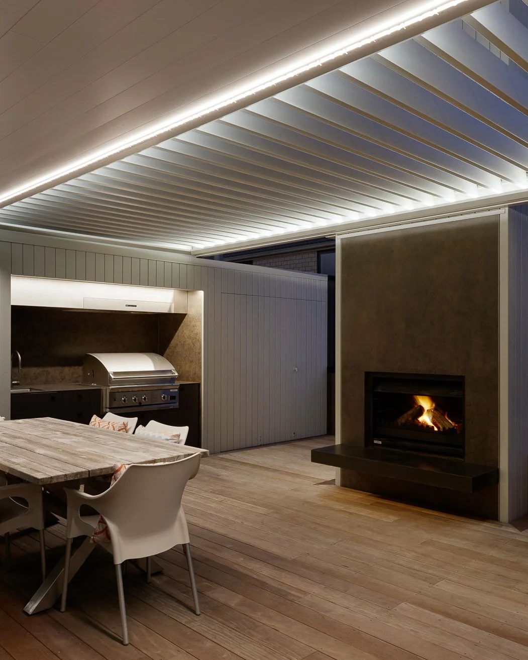 Some of our favourite outdoor living spaces from past projects - because a well-designed outdoor area should earn its keep year-round.

An outdoor fireplace, considered shelter, and the right materials make all the difference when the cooler months r