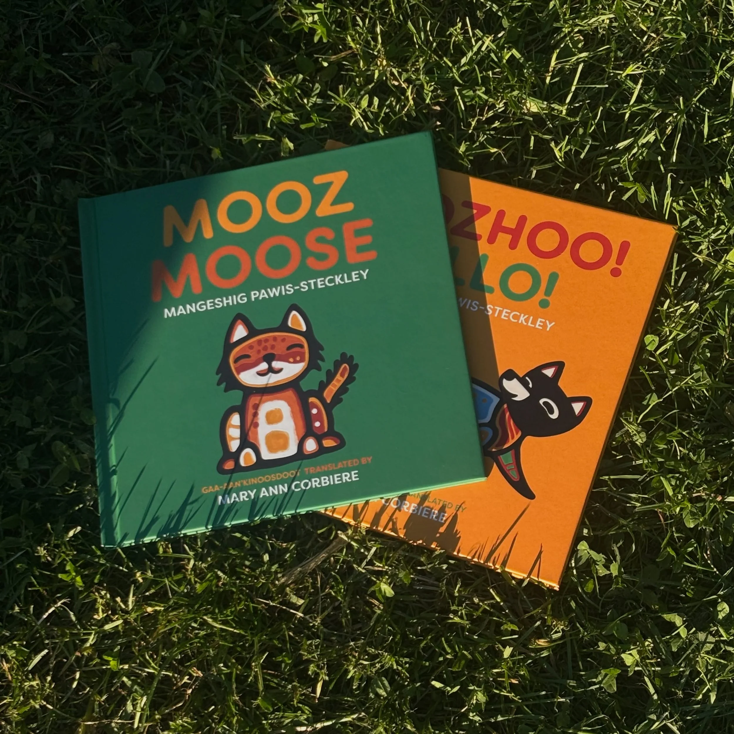 The first copy of the next book came in the mail last week &amp; we were so excited! It&rsquo;s a book about our cat named Mooz so we had to do a family photoshoot in the park. MOOZ/MOOSE is the next book in the Anishinaabe language book series with 