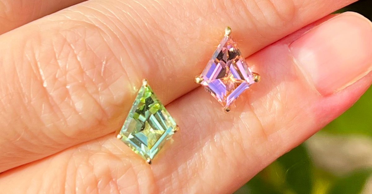 mismatched-pink-green-tourmaline-stud-earrings-between-fingers.jpg