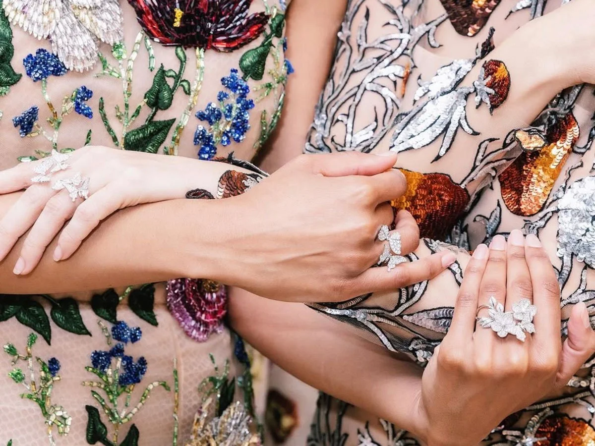 Women wearing butterfly rings and high fashion