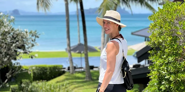 woman-looking-over-shoulder-at-luxury-resort.jpg