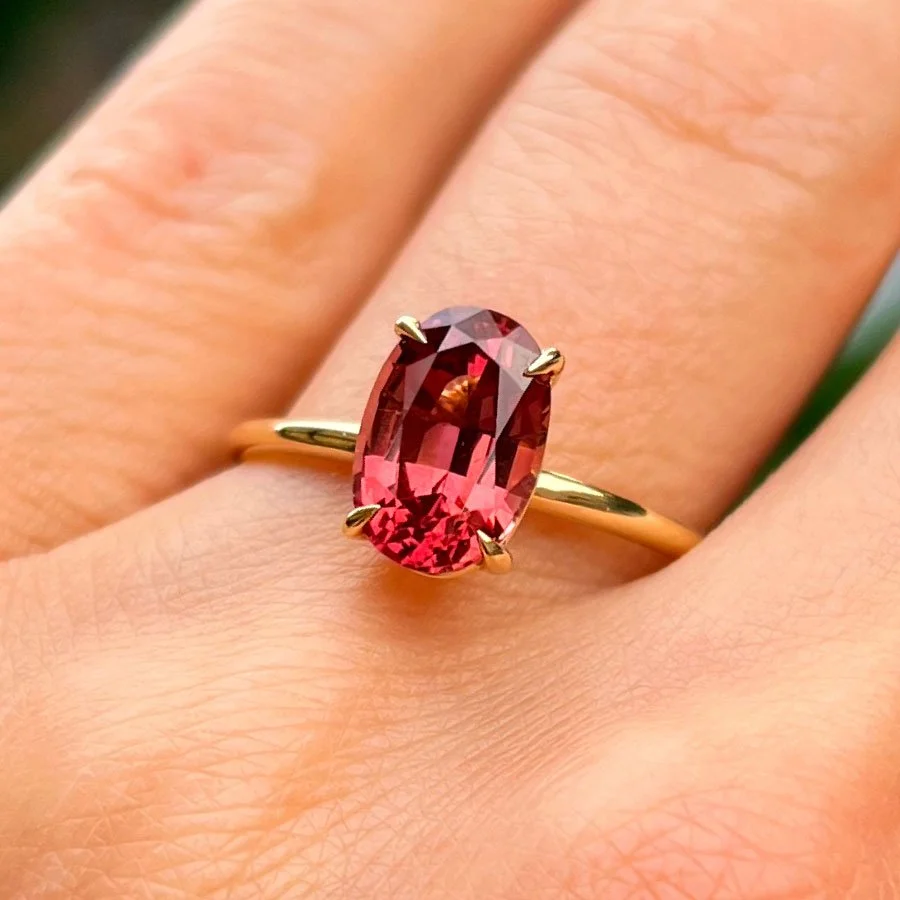 colored-gemstone-engagement-ring-on-hand.jpg