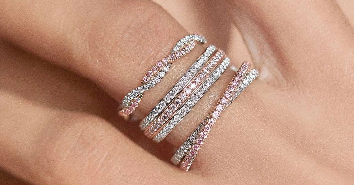 pink-diamond-eternity-bands-as-ring-stack-on-womans-finger.jpg