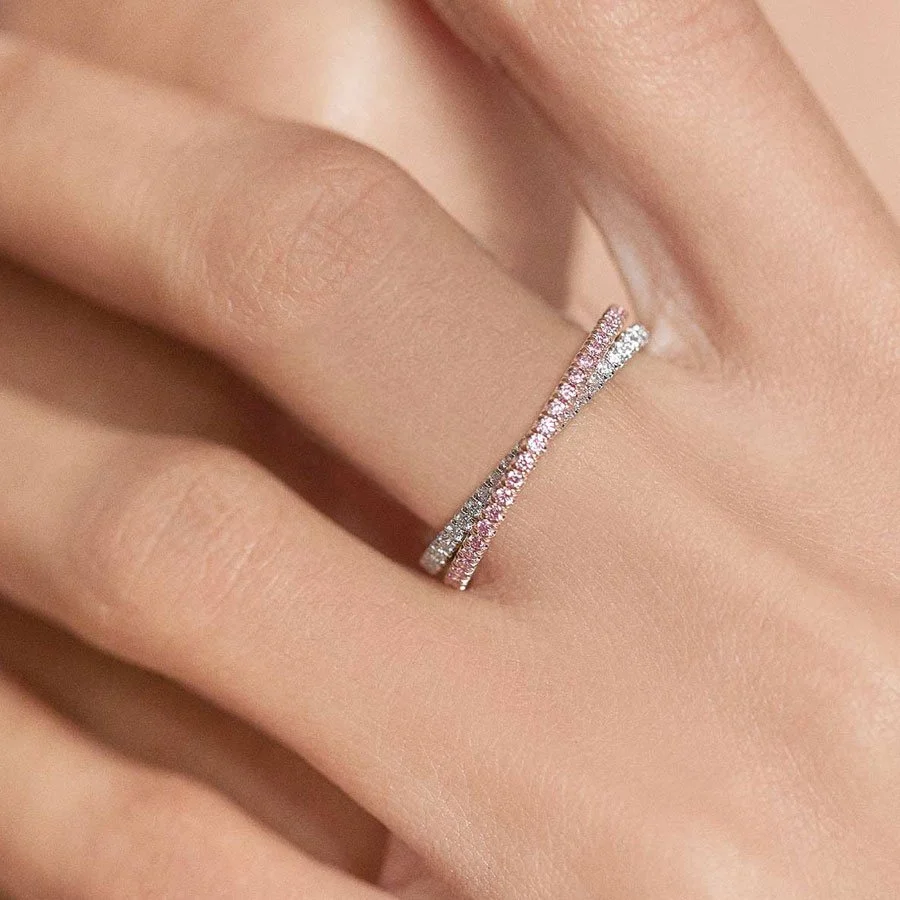 Pink Diamond Stacking Eternity Rings on Hand of Woman