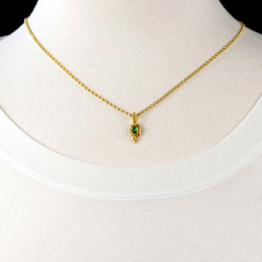 Green garnet gold pendant with diamonds on bust