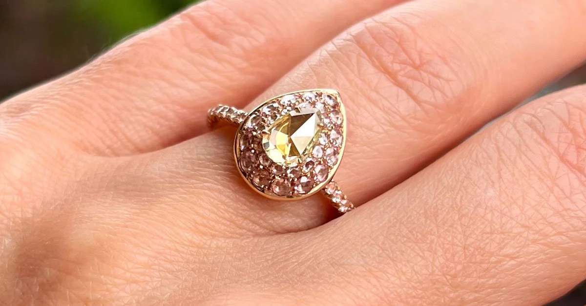 rose-cut-diamond-engagement-ring-with-yellow-and-pink-diamonds-on-hand.jpg