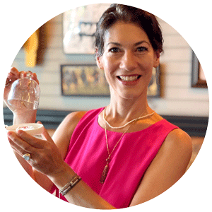 woman holding rare gemstones on tray