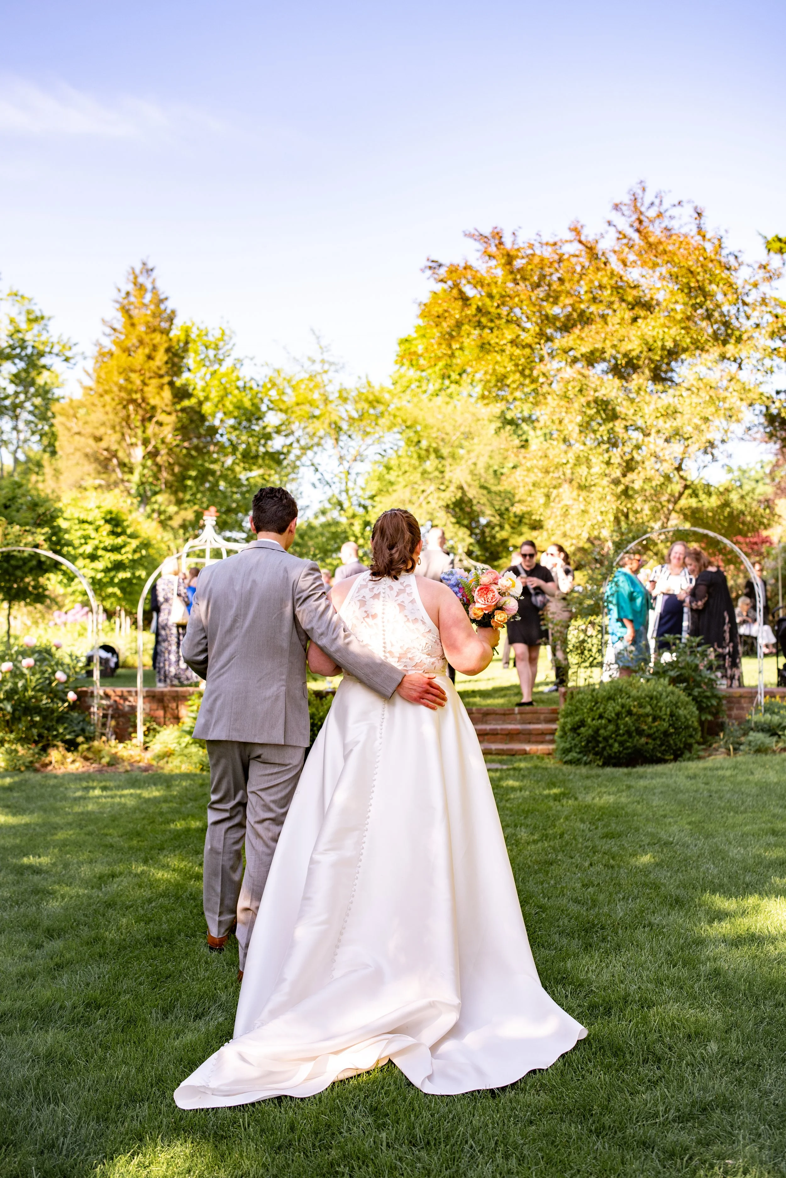 Bride and Groom arriving to cocktail hour at Long Hill Beverly