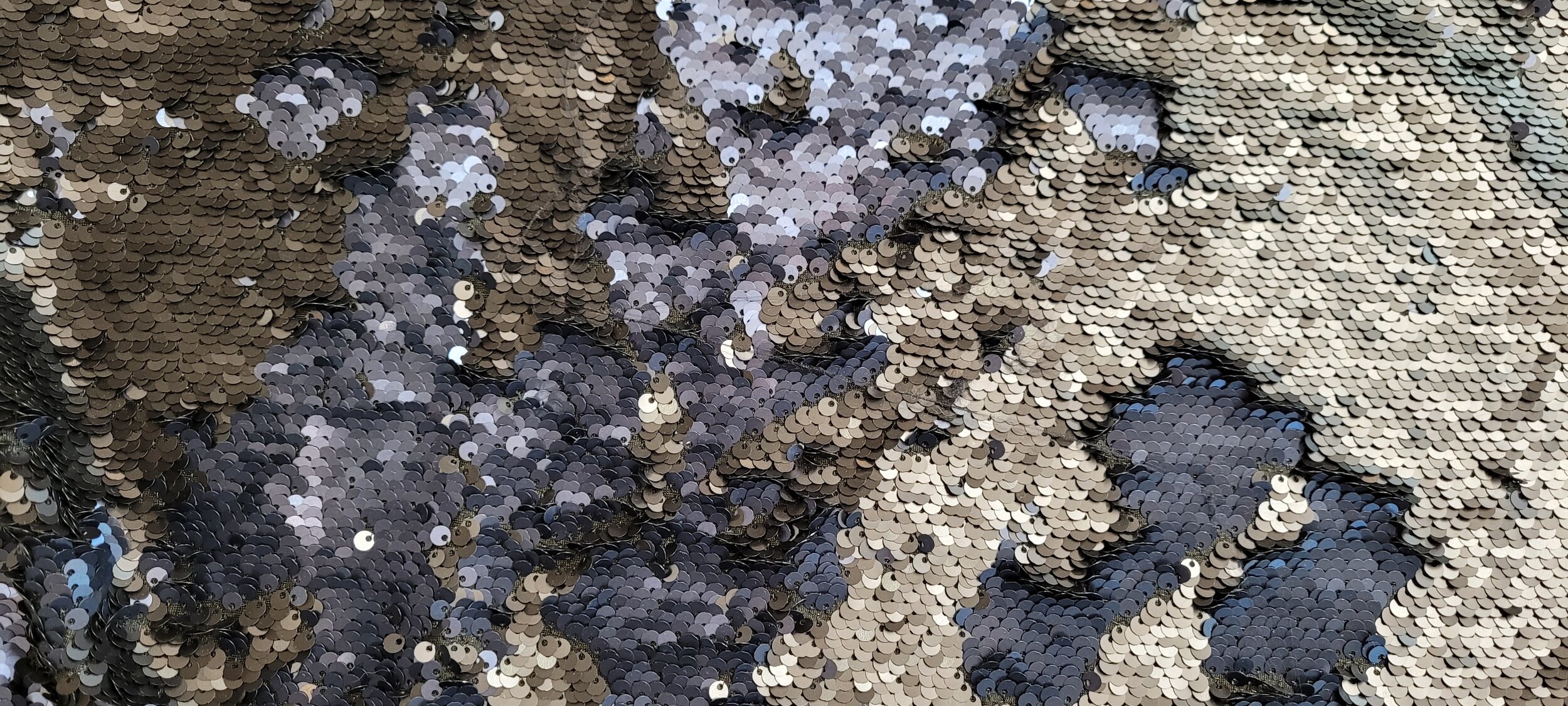 Blue and Charcoal Two Tone Reversible Sequin Fabric with a Black Mesh Background
