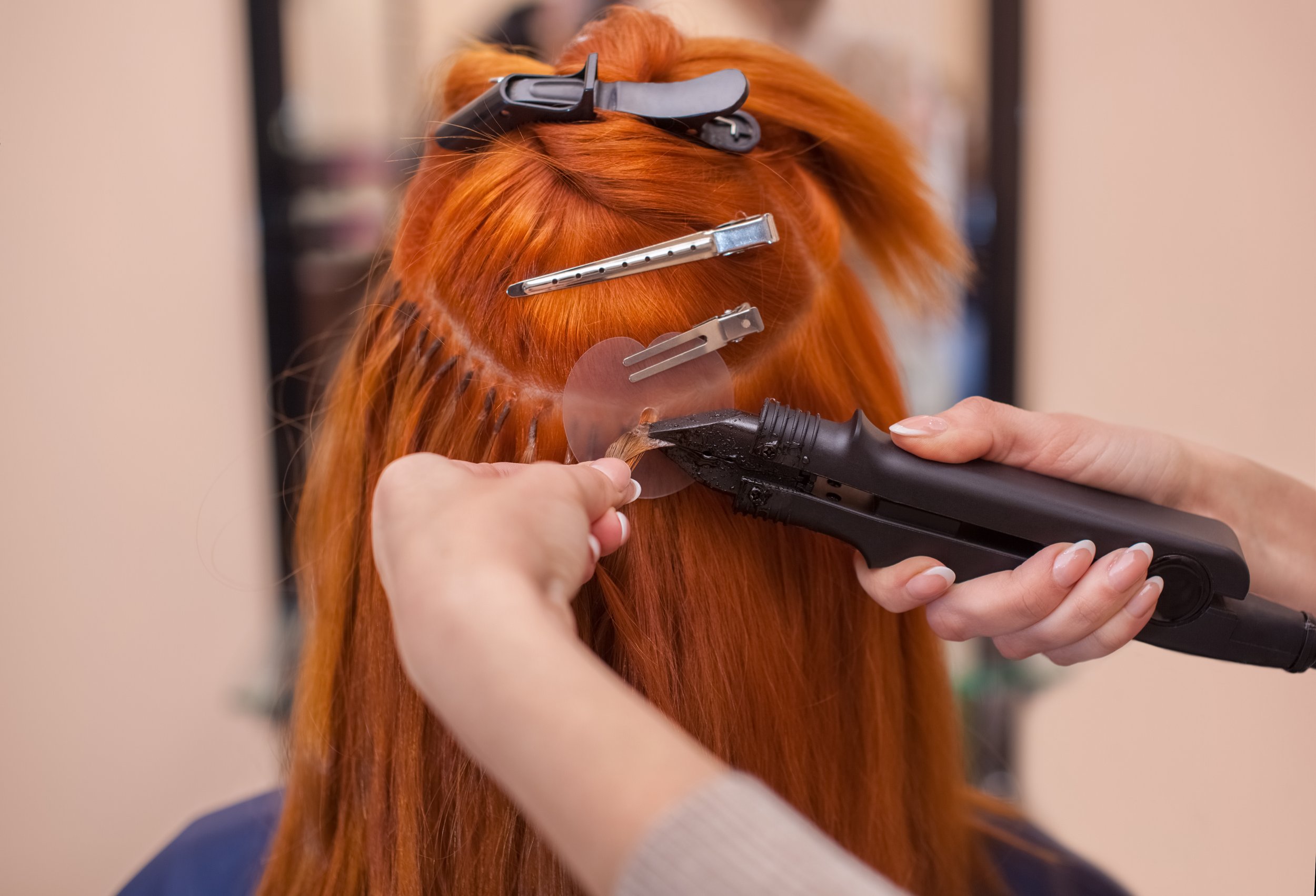 hairdresser-does-hair-extensions-to-a-young,-red-haired-girl,-in-a-beauty-salon-671018962_5320x3621.jpeg