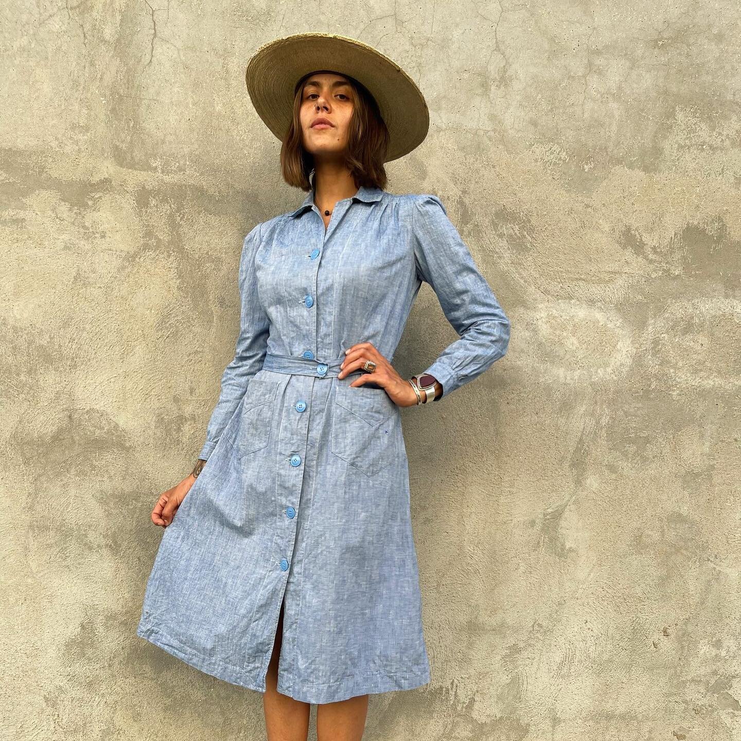c. 1940s French chambray chore dress with the best details 🌻 Button-front, front pockets, collar, button-front belt. Condition is good with a couple light rust spots and small distressed area on pocket. Fits like a S/M - M. 
.
Sold
.
Shoulder: 15&rd