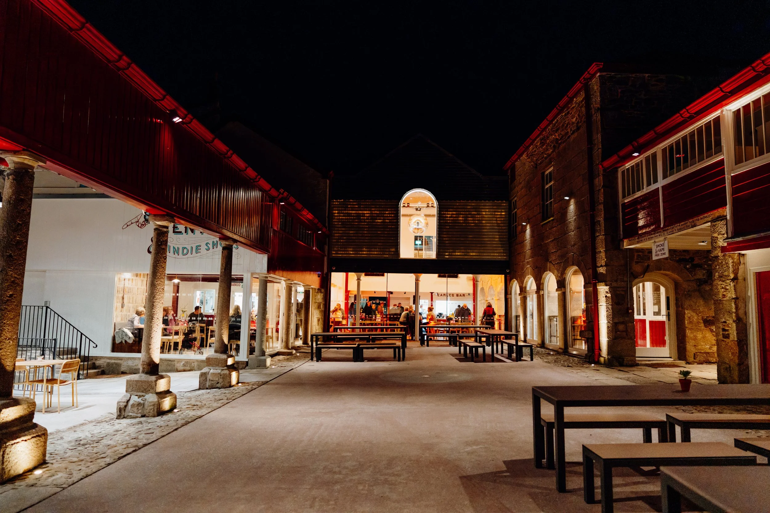 The courtyard of the Buttermarket at night, showcasing the light penetration through the recycled glass tiles. Photo: Huw Briscoe